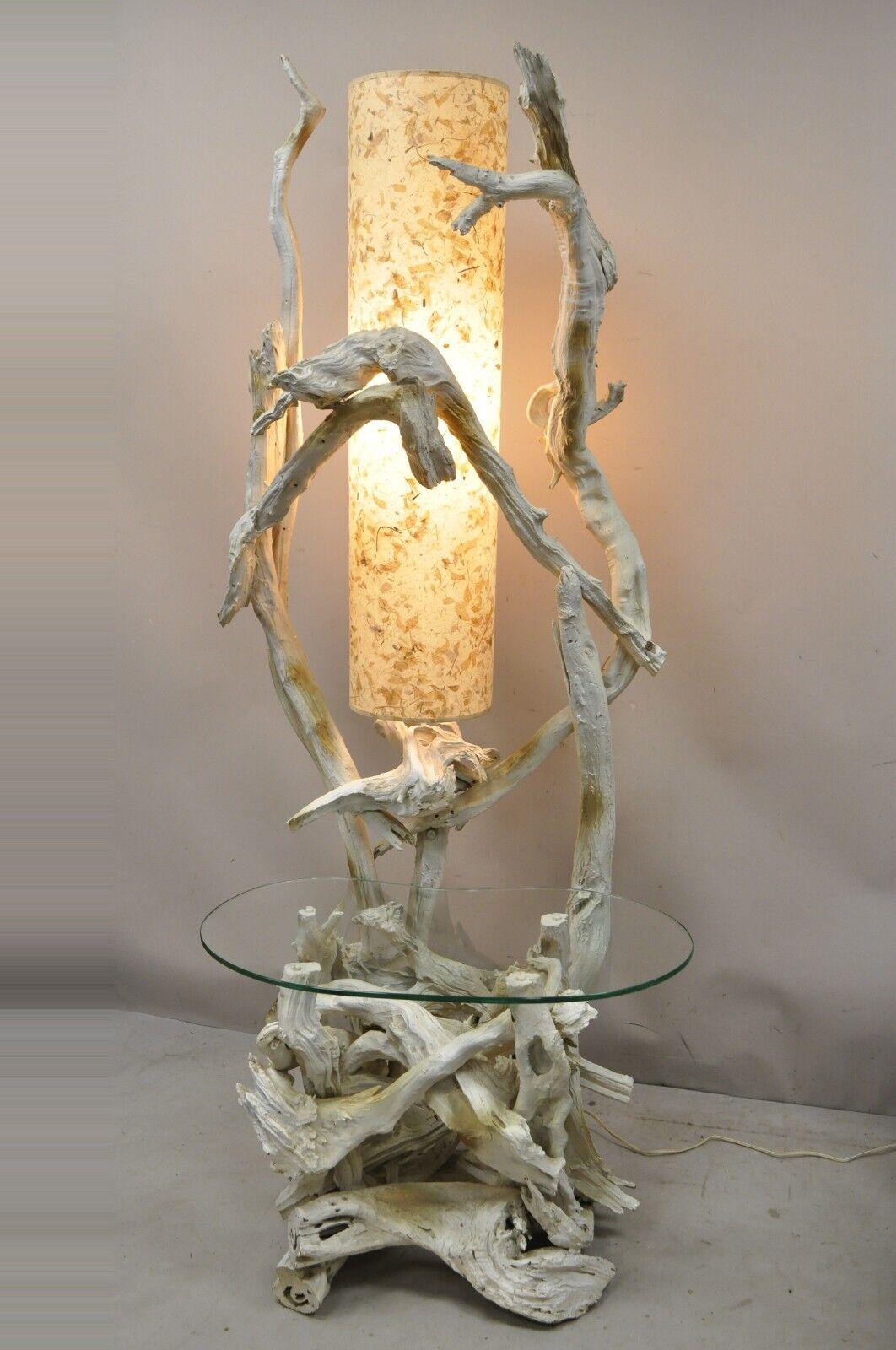 Vintage Driftwood Mid-Century Modern white floor lamp with side table. Item features Impressive driftwood frame, kidney shaped glass top, single lamp socket, original lamp shade which appears to be decorated with dried leaves, white and gold painted