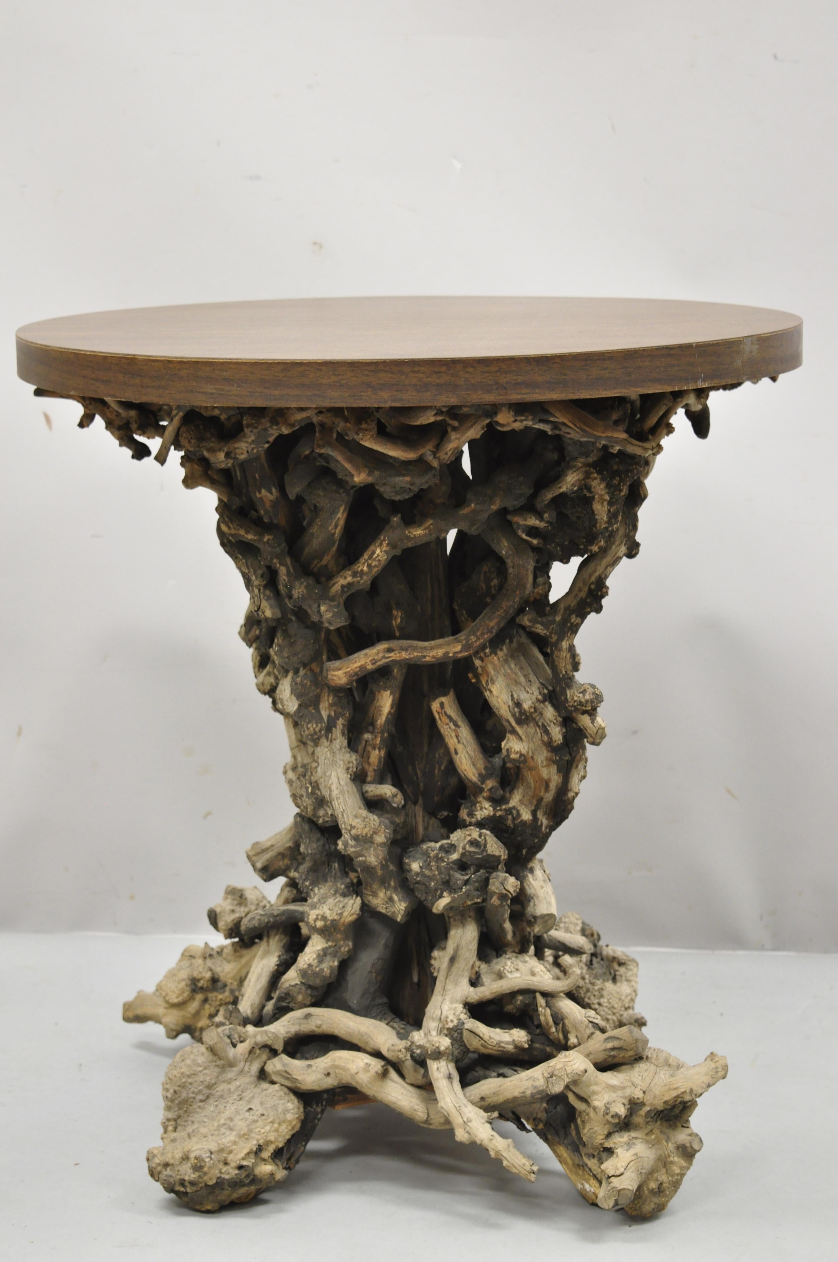 Vintage driftwood root base drift wood pedestal base naturalistic round accent side table. Item features round laminated top, driftwood free form root pedestal base, very nice vintage item, great style and form, Circa Mid 20th century. Measurements: