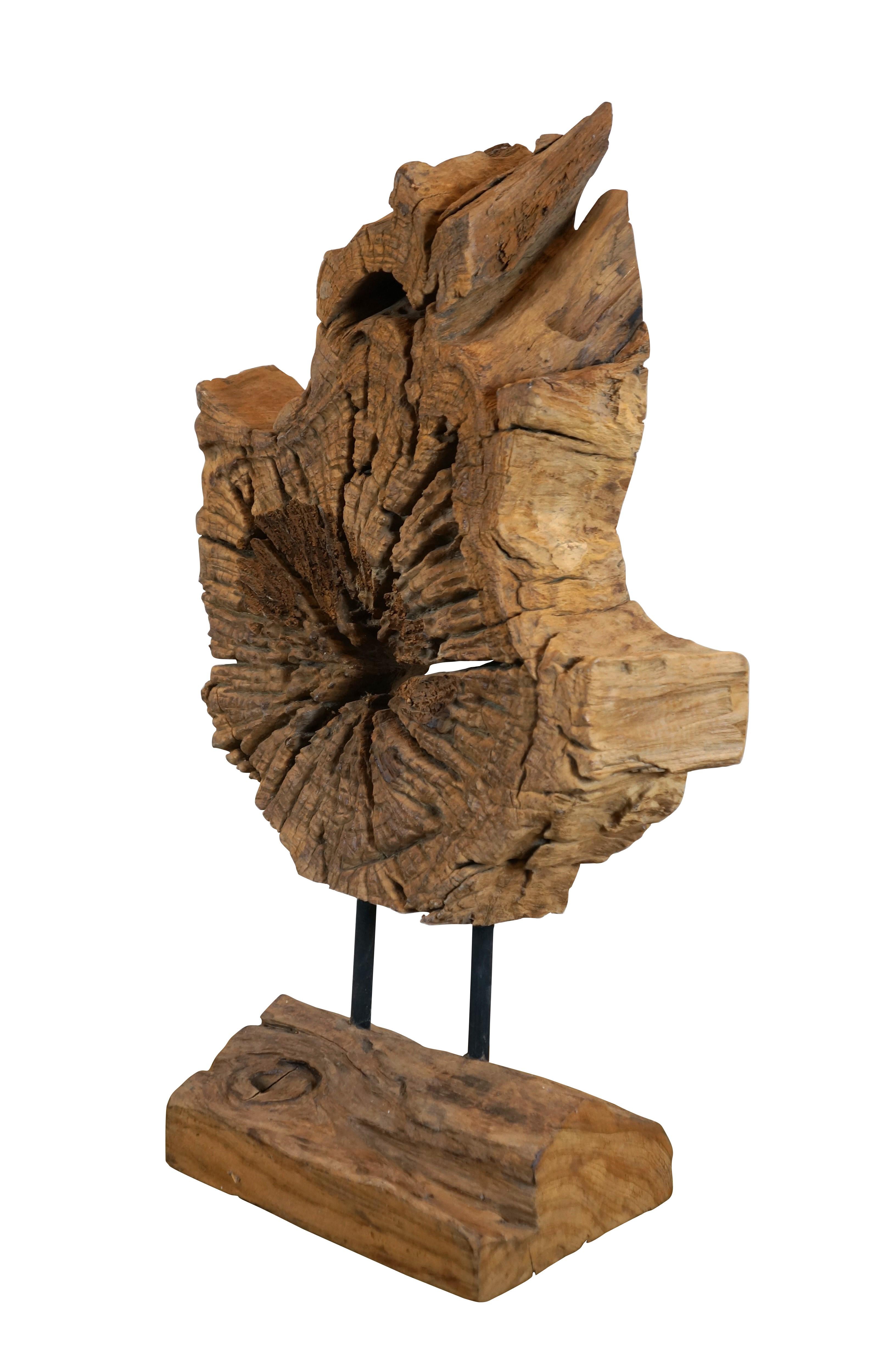 Large slice of natural wood with live edge mounted on a wood and iron base featuring the formed shape of a five pointed star in the center.

Dimensions:
18