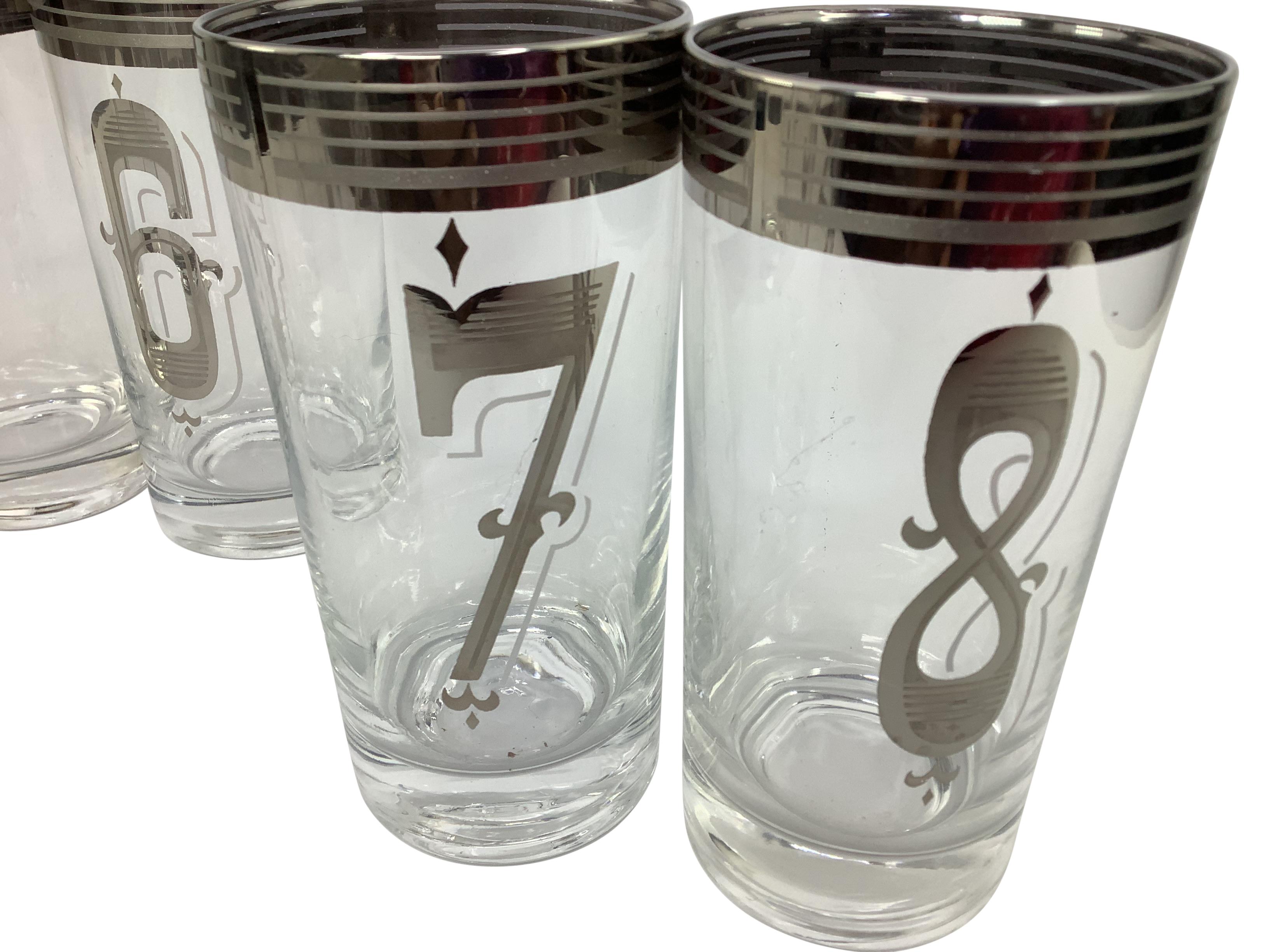 Set of 8 vintage numbered highball cocktail glasses with silvered band. Glasses are 5 1/2