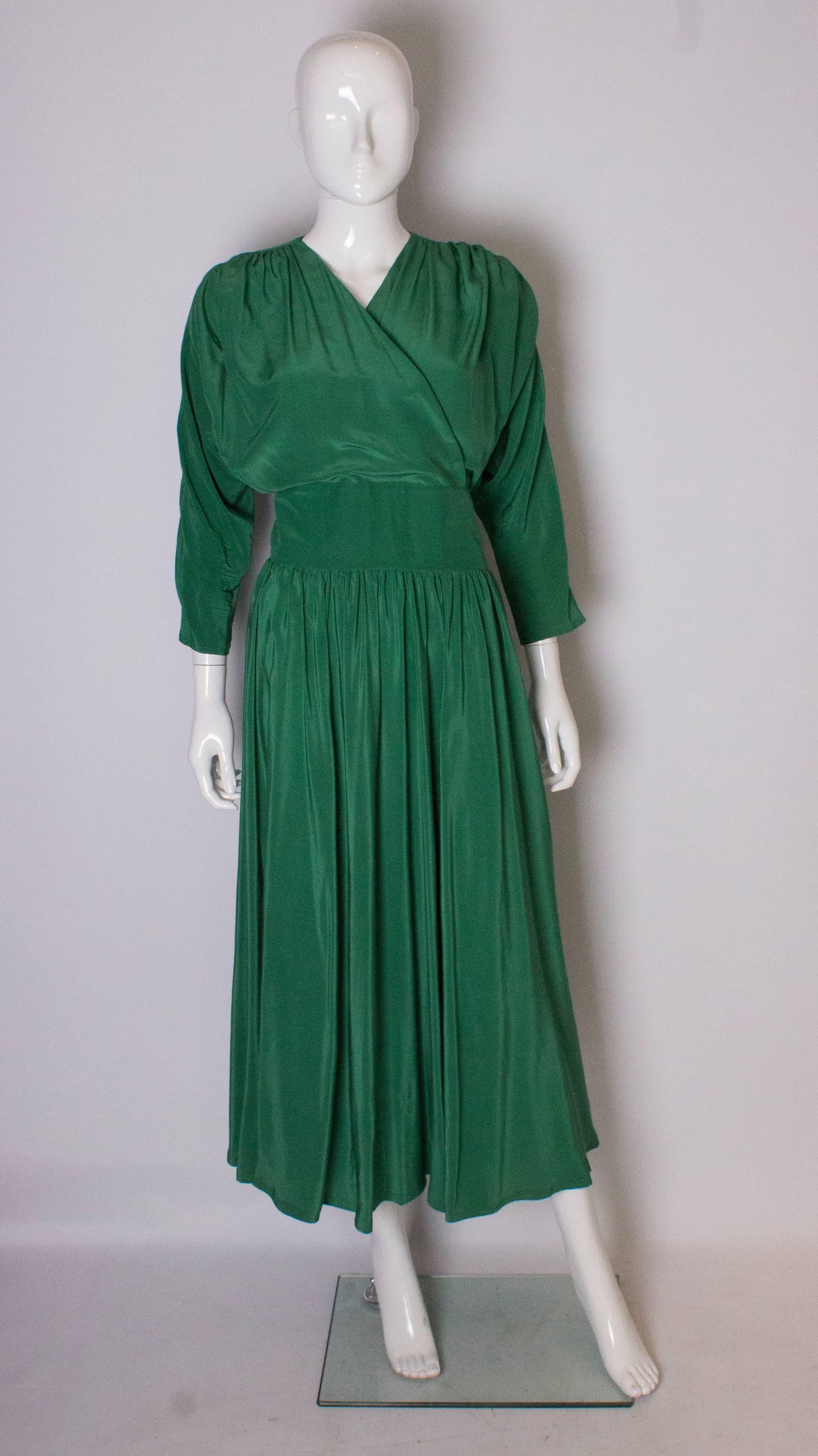 An elegant and easy to wear dress from Droopy and Browns. The dress has a wrap over front , central back zip and gathered waist area.
