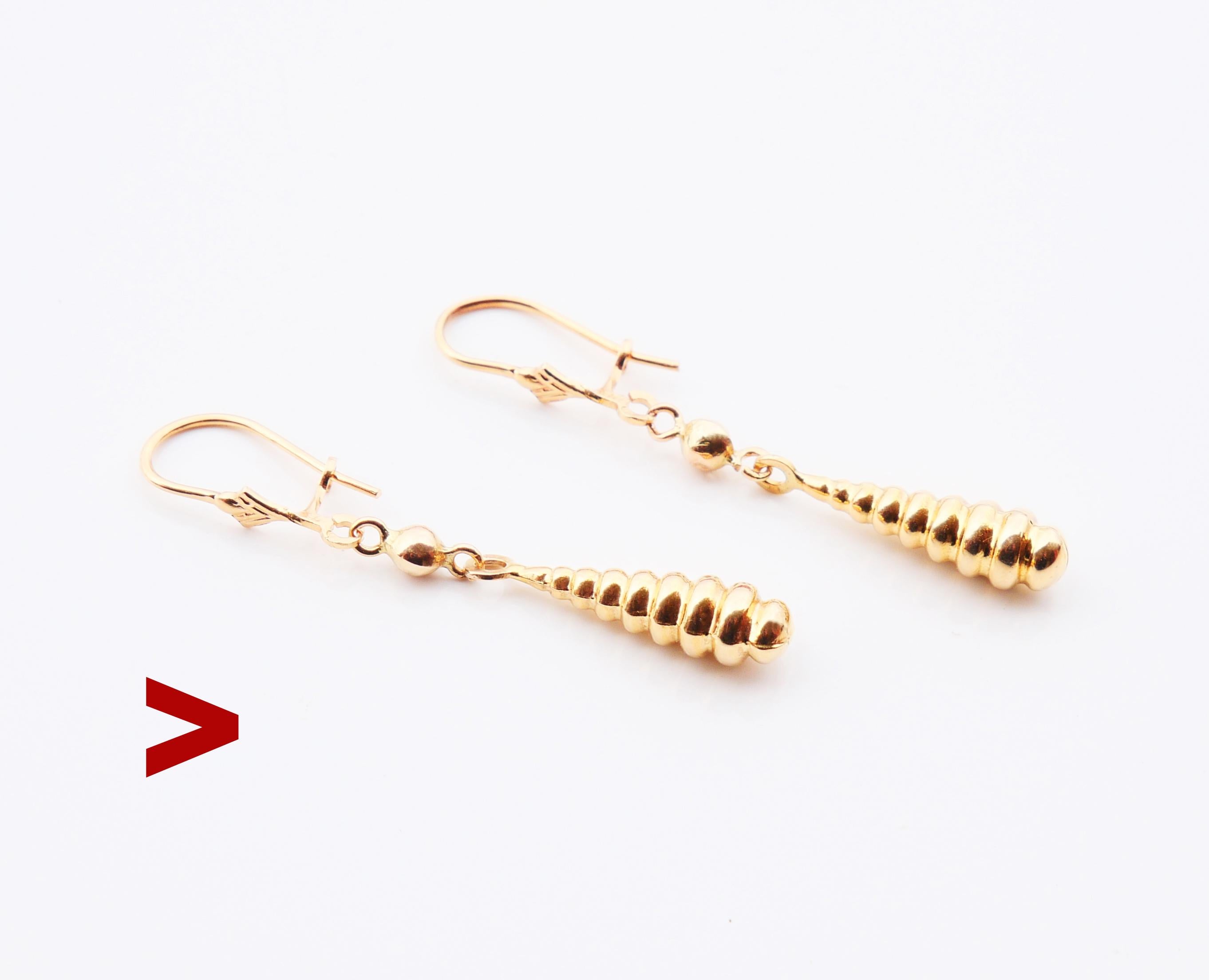 A pair of dangles from 1950s - 1960s in solid 18K Yellow Gold with freely suspended drops ,hollow inside but very firm to touch. Hooks hallmarked 750 / all parts tested solid 18K Gold.

Each earring is 40 mm long suspended including the hanger, each