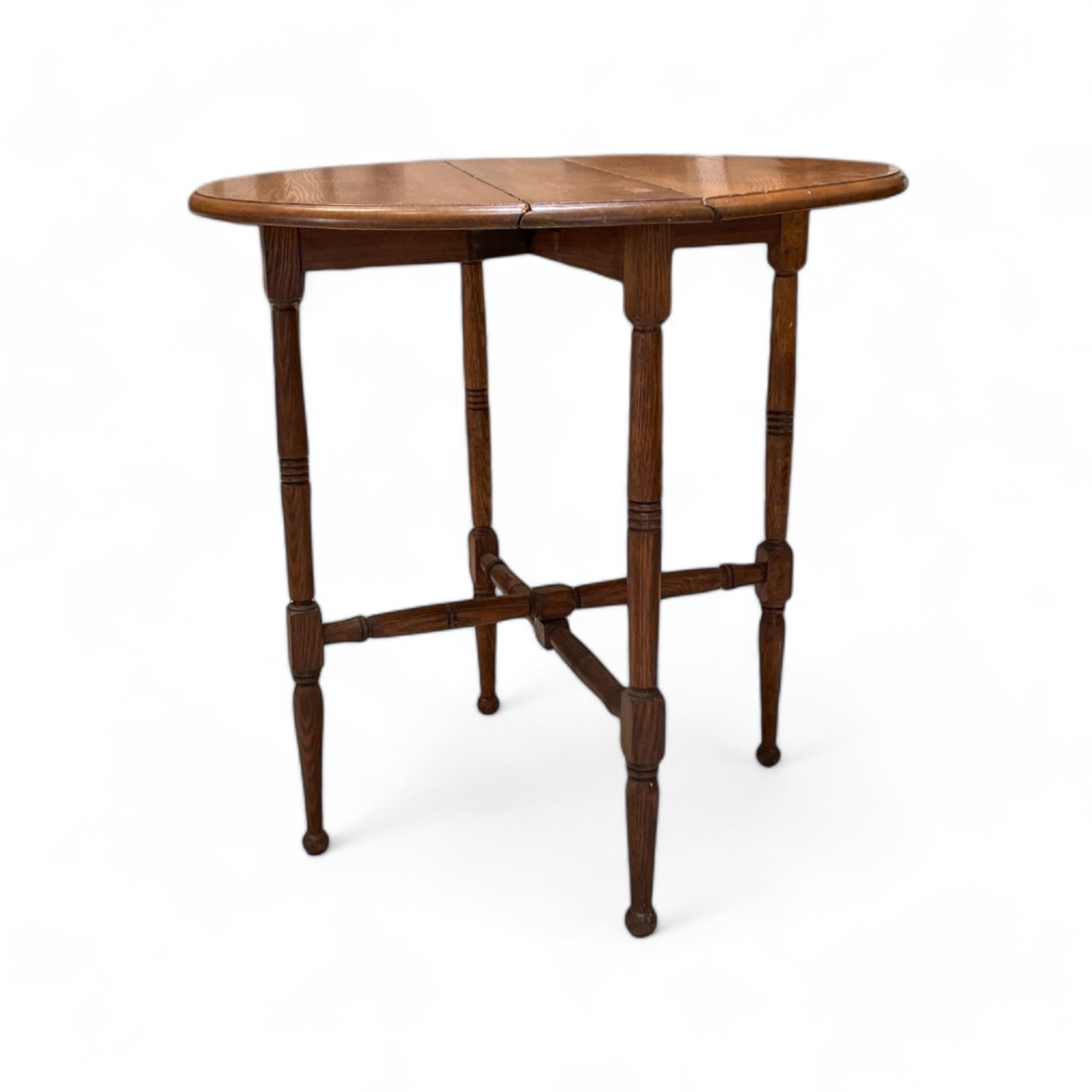 antique round drop leaf table