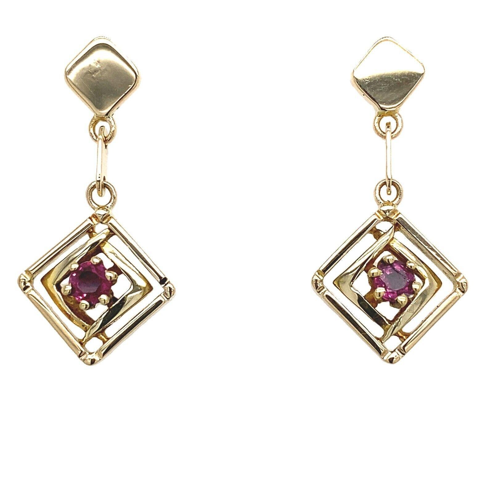 This vintage pair of drop ruby earrings are beautiful. Are set in 14ct yellow gold with peg and butterfly, set with 0.35ct round rubies.

Additional Information: 
Total Weight: 4.5g
Earrings Dimension: 27mm x 12.5mm
SMS8281