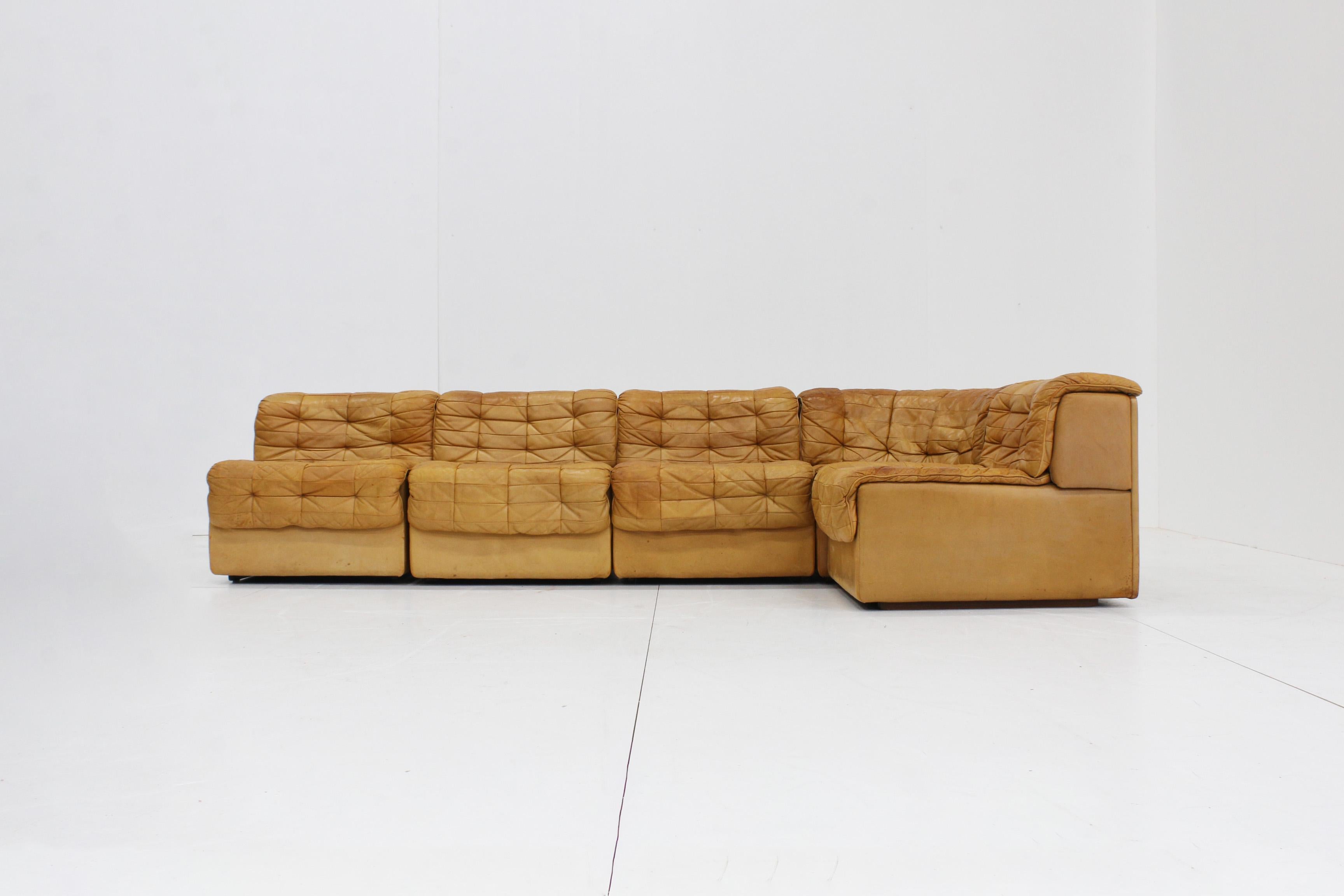 Original vintage De Sede DS-11. The sofa has 5 parts, 1 of which is a corner element. Equipped with cognac leather with beautiful patina. Please view the photos to see the condition. This sofa provides a statement and character in your interior. The