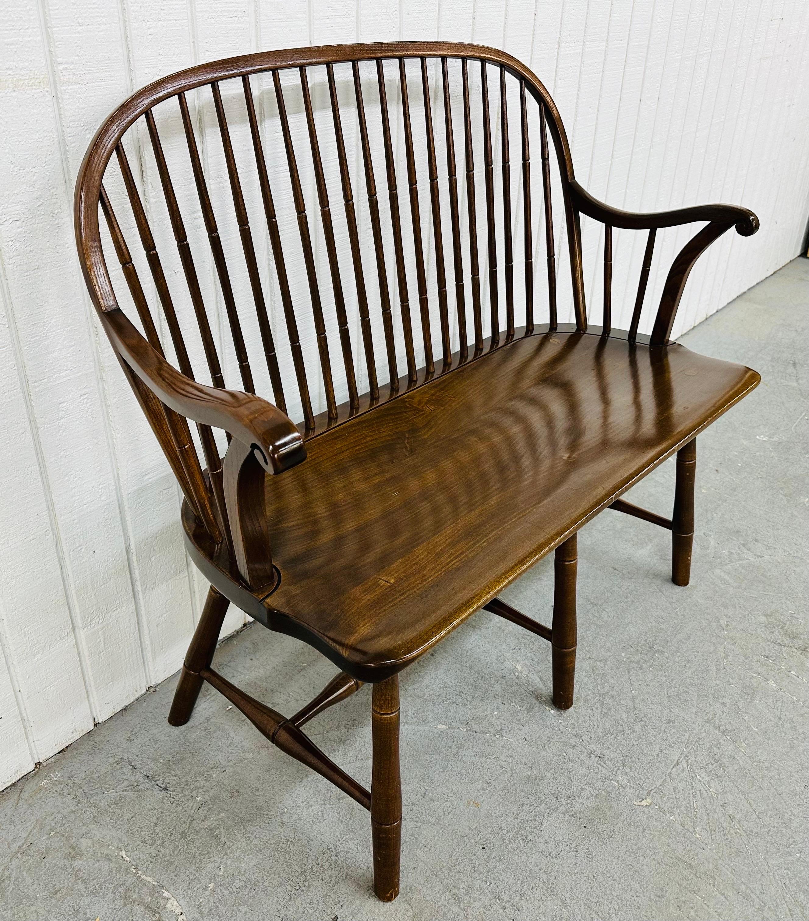 This listing is for a Vintage Duckloe & Bros. Windsor Style Cherry Bench. Featuring a Windsor style spindle back design, curved arms on each side, six legs with stretcher base, cherry wood bench seat, and a beautiful walnut finish.