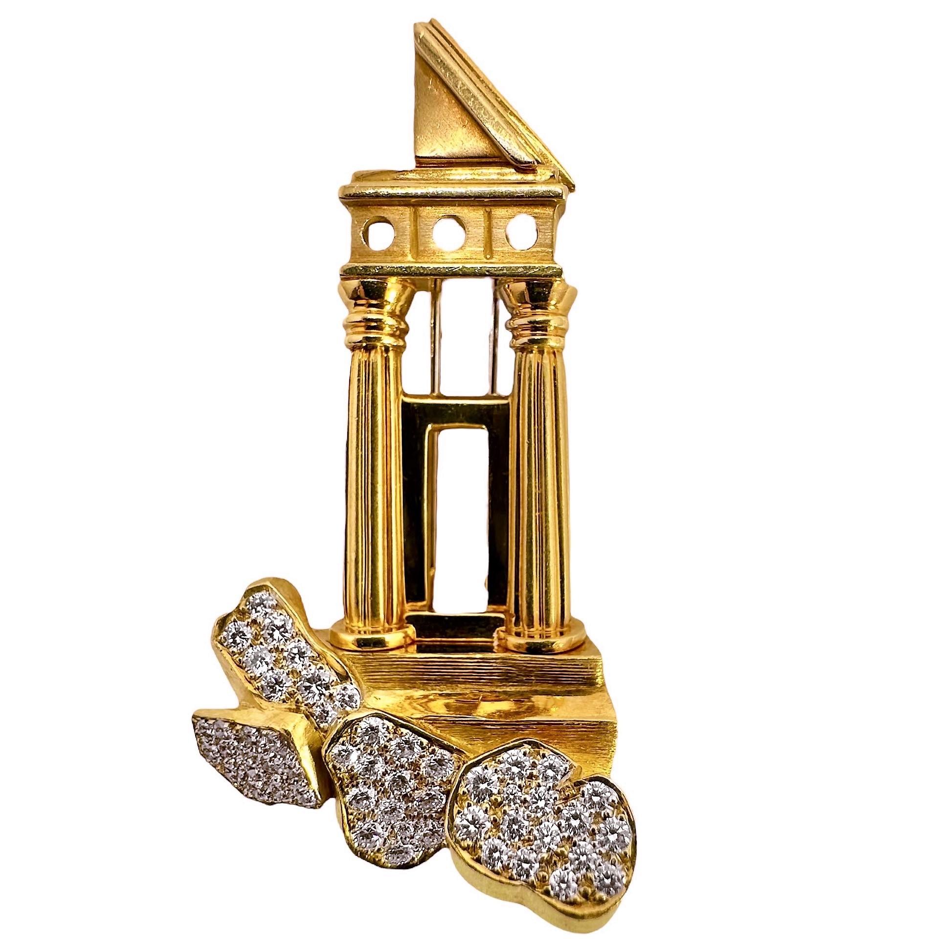 This striking vintage Dunay gold and diamond brooch evokes images of the Greek Parthenon or perhaps the ancient Roman Forum. It is large, measuring in excess of 2 inches long by 1.14 inches wide. It is very dimensional with bold columns and roof