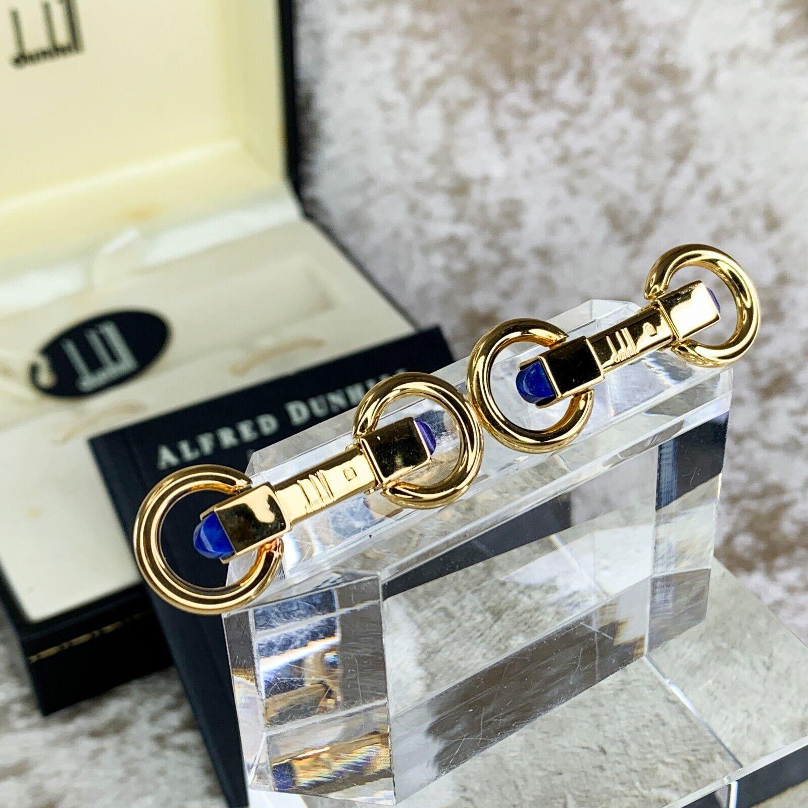 Elegant Vintage Dunhill Cufflinks 
Gold Plated Blue Lapis Lazuli Gems
Circa 2000
The Cufflinks are 18 k Gold Plated 
With original Dunhill case 
Certificate Guarantee 
In mint condition 
Does not look like they have been used 
Signed Alfred Dunhill 