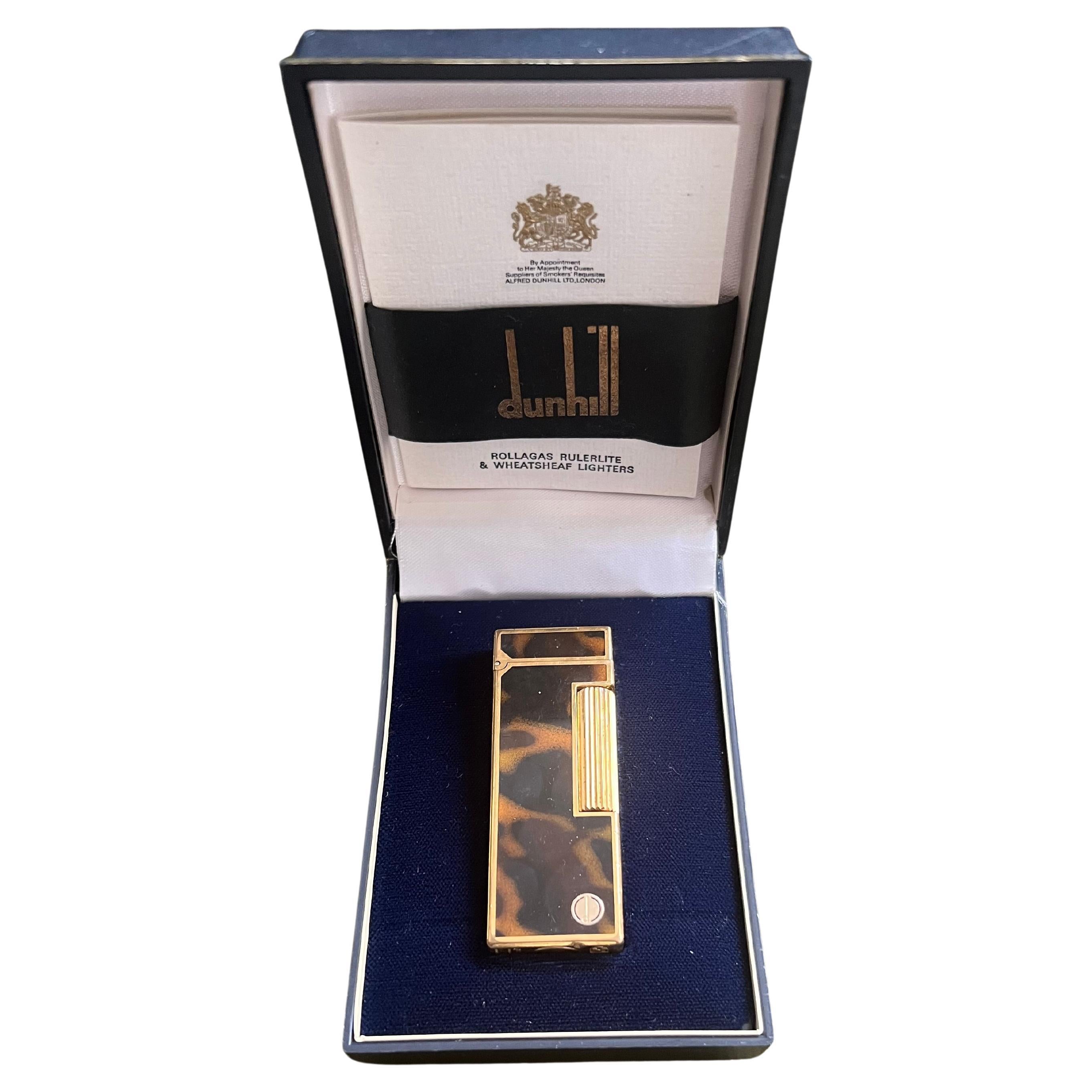 Vintage Dunhill Gold Plated Rare Cognac Marble Lacquer Lighter Original Case
Circa 1970

Rare Vintage Dunhill gold plated lacquer Swiss Made lighter In mint condition.
Works perfectly. 
Iconic and beautifully engineered piece with rare lacquer