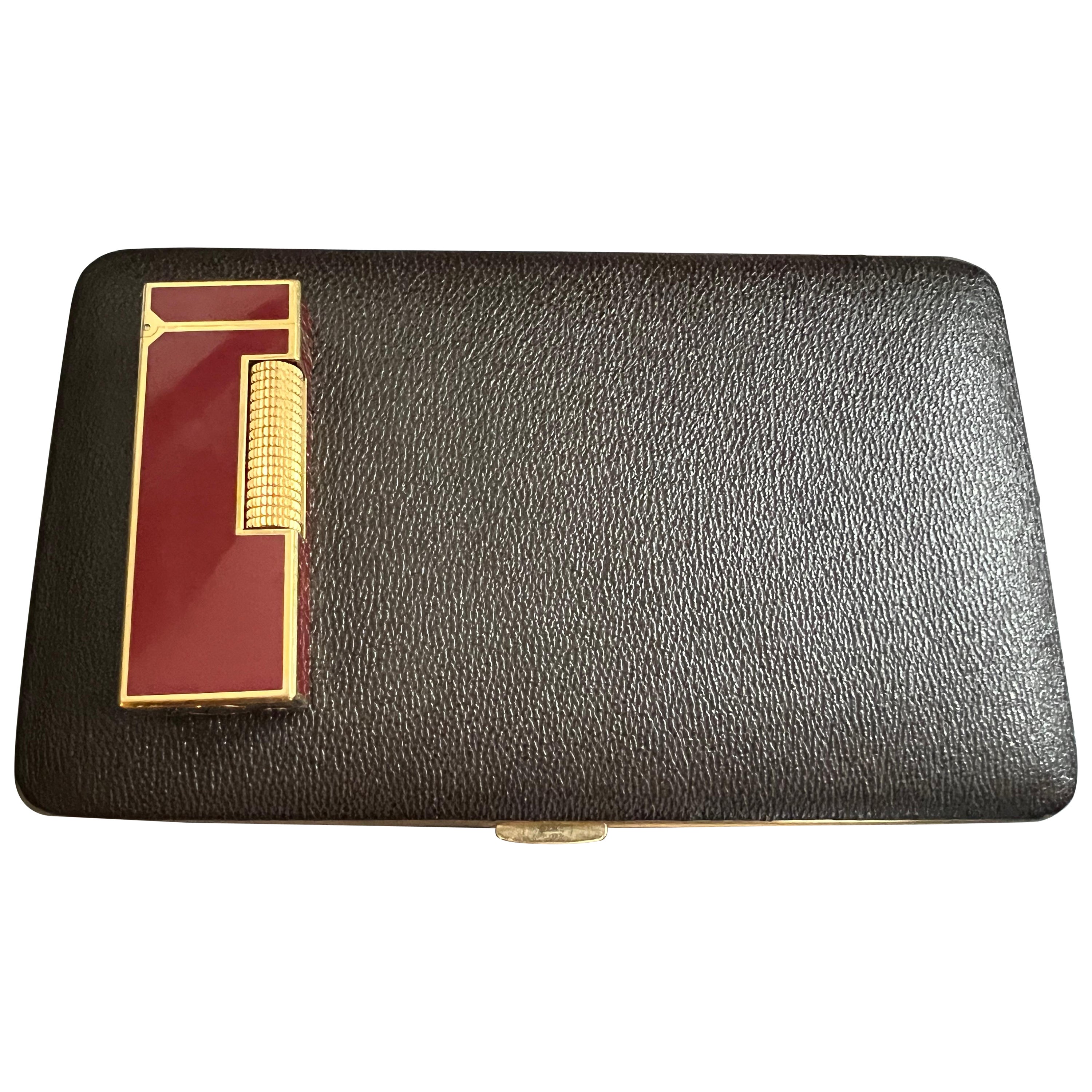 Gift Set that is rare and beautiful.  
The vintage case was made in Japan. 
Looks like it has never been used. 
The lighter is a red vintage dunhill in mint condition. 
The lighter sparks, ignites and flames. 
Perfect for a gift idea that is unique