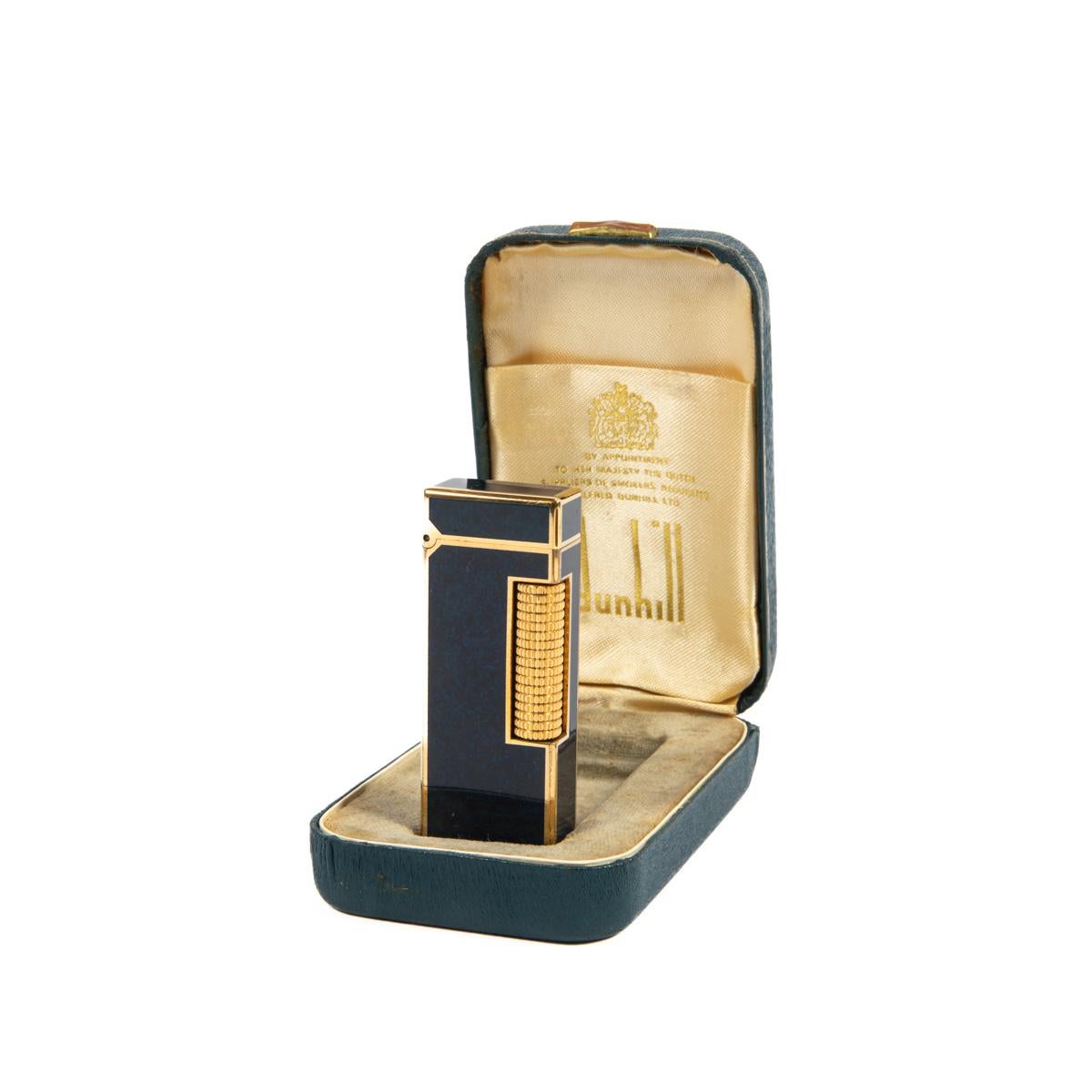 Vintage Dunhill Rollagas lighter Lapiz Lazuli Gold Plated In Box 1980s

The iconic Dunhill name is known for quality, well-made cigarette lighters and other smoking implements. The company’s origin can be traced to Alfred Dunhill opening his first