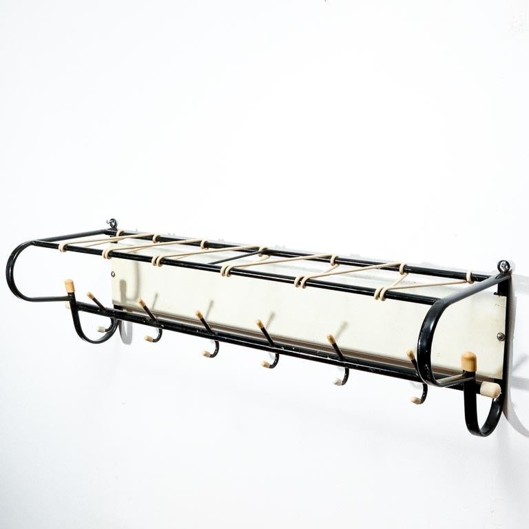 Vintage Dutch coat rack in black painted steel with white rubber hat shelf.