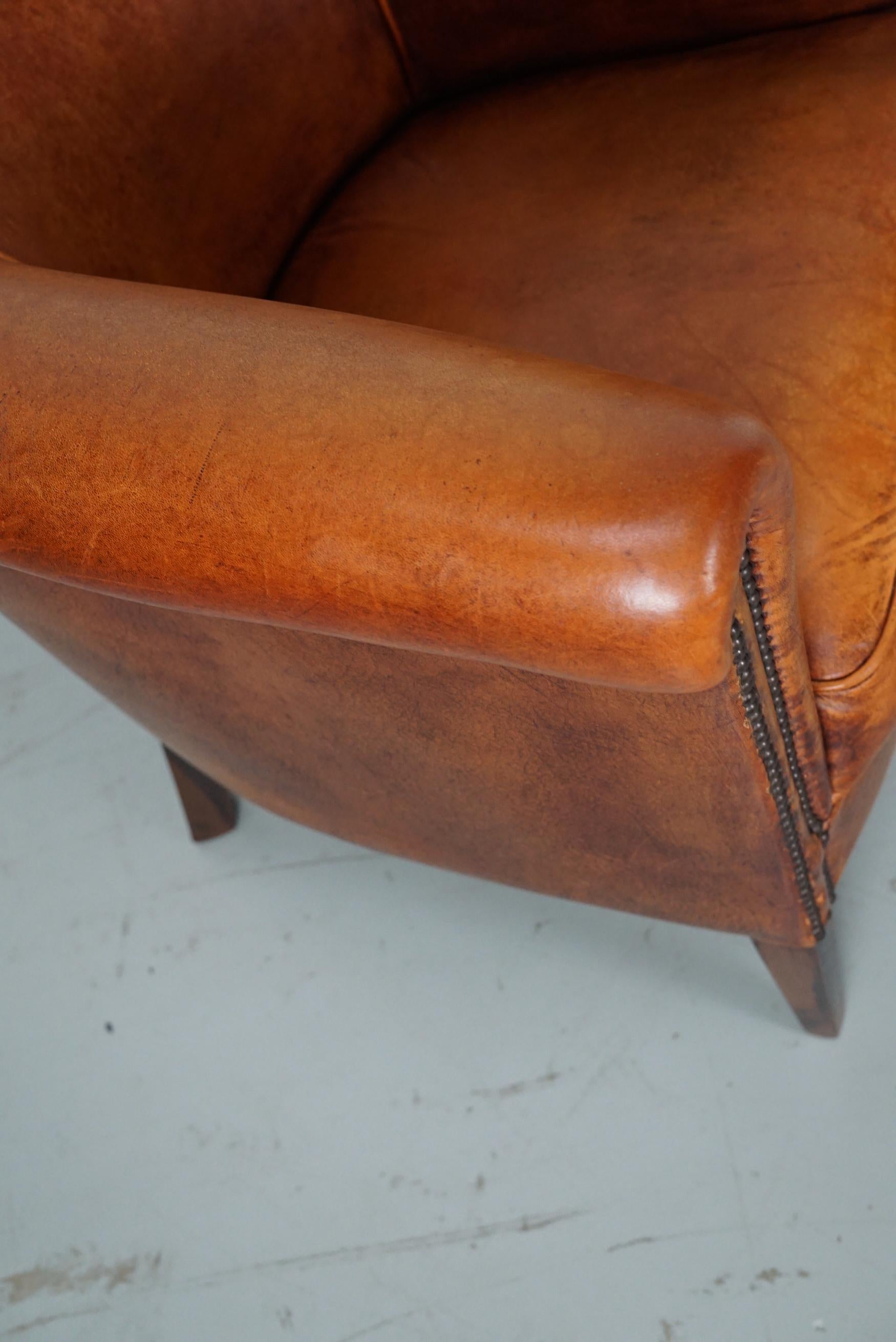 Cognacfarbener Clubsessel aus Leder im Angebot 5
