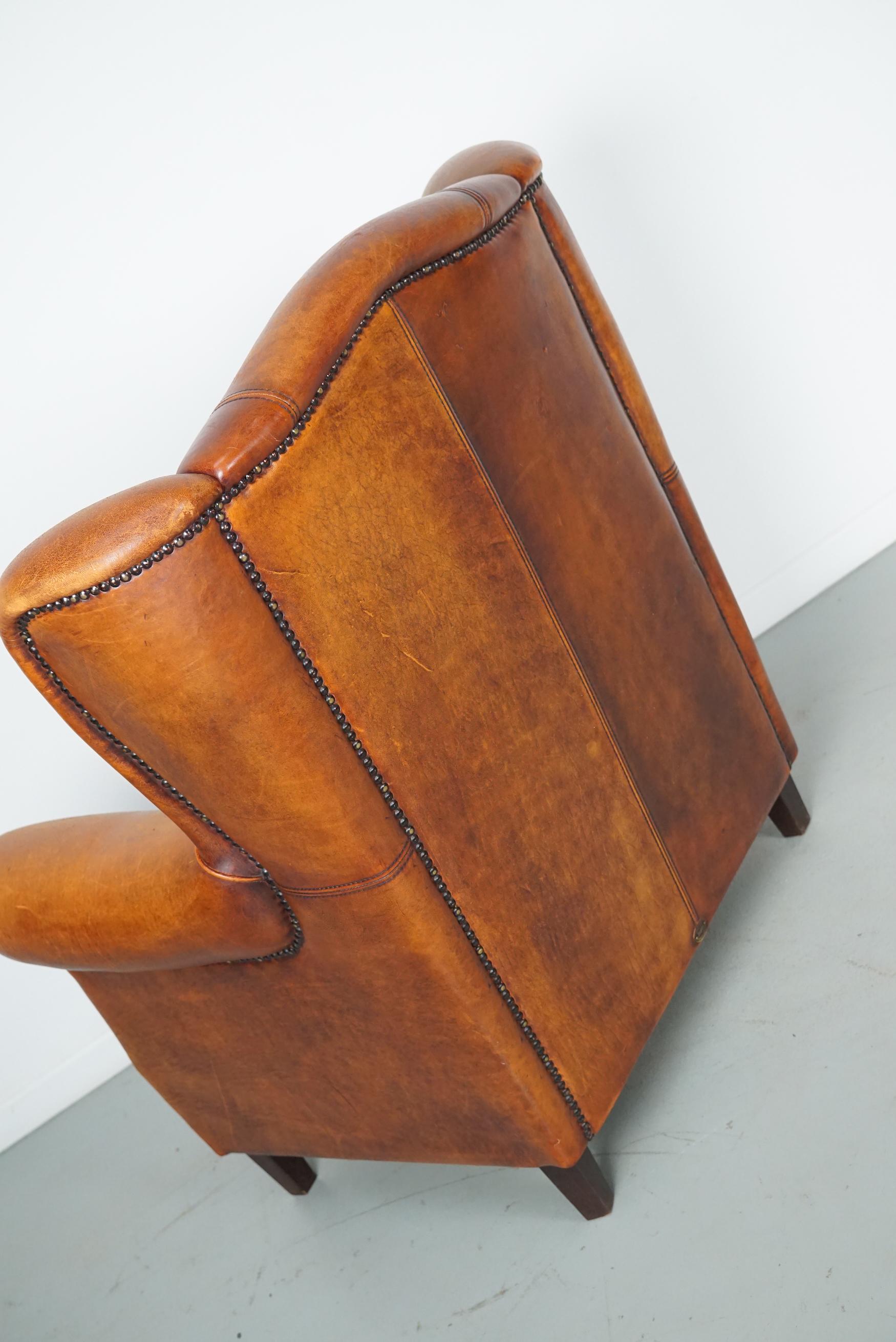 Cognacfarbener Clubsessel aus Leder im Angebot 5