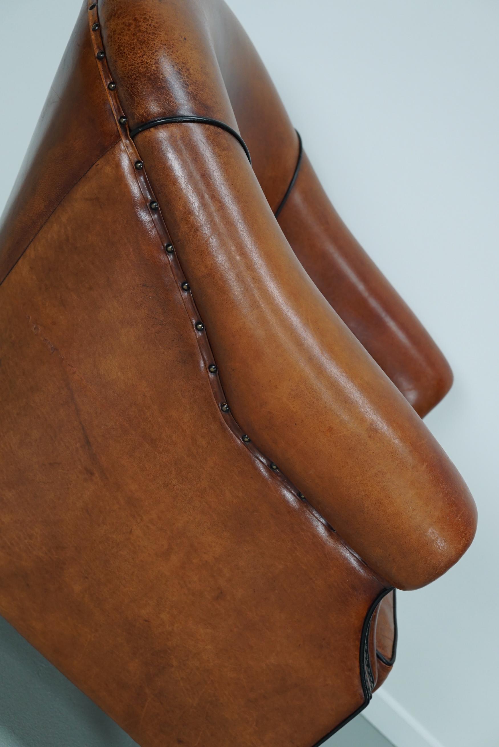 Cognacfarbener Clubsessel aus Leder im Angebot 5