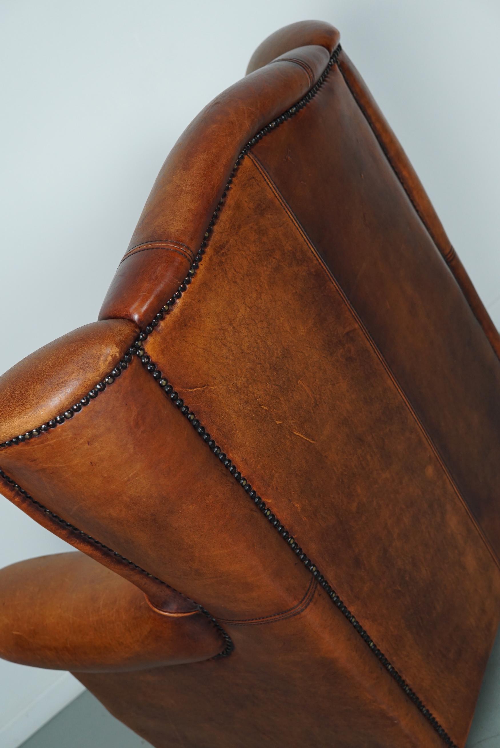 Cognacfarbener Clubsessel aus Leder im Angebot 6