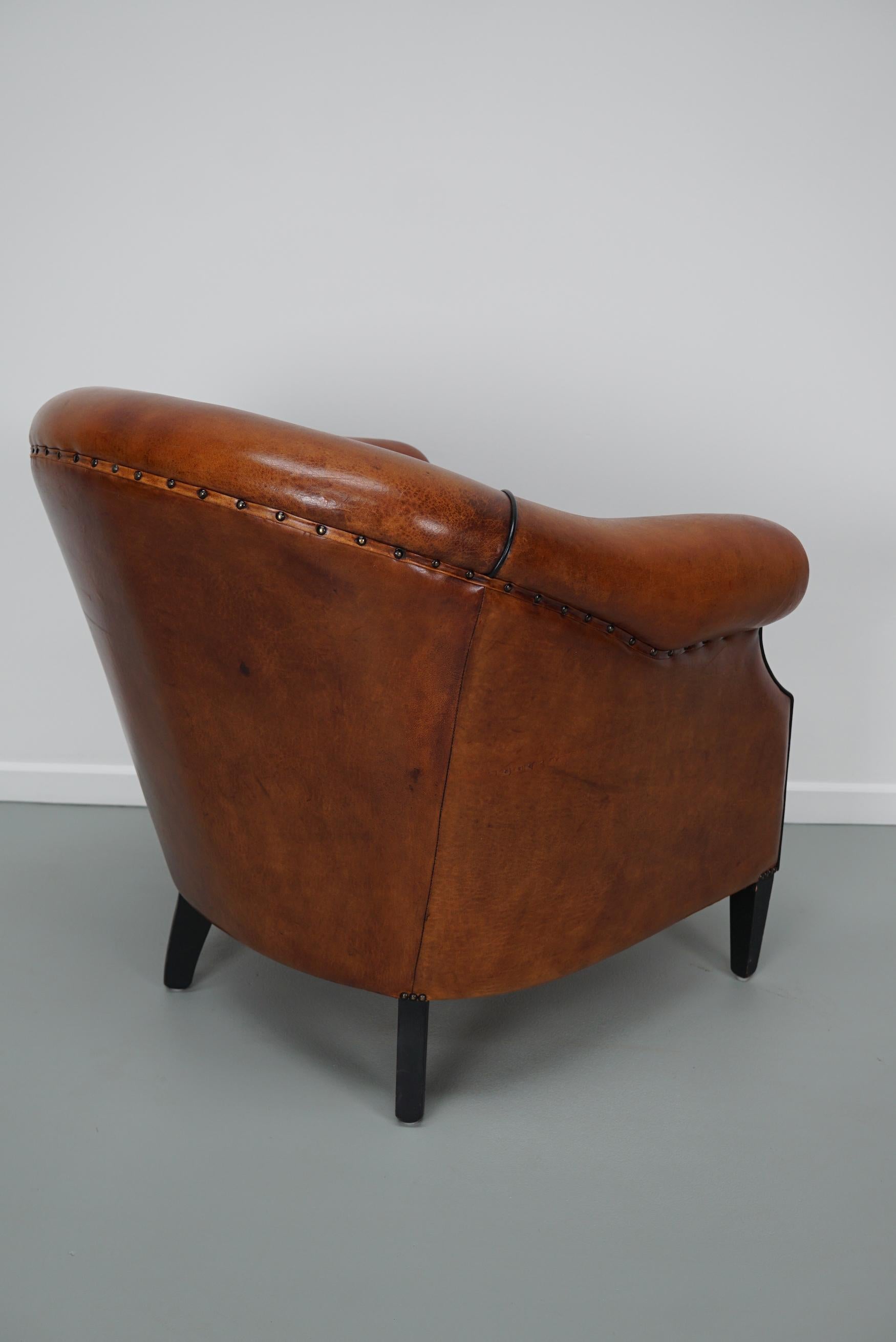 Cognacfarbener Clubsessel aus Leder im Angebot 6
