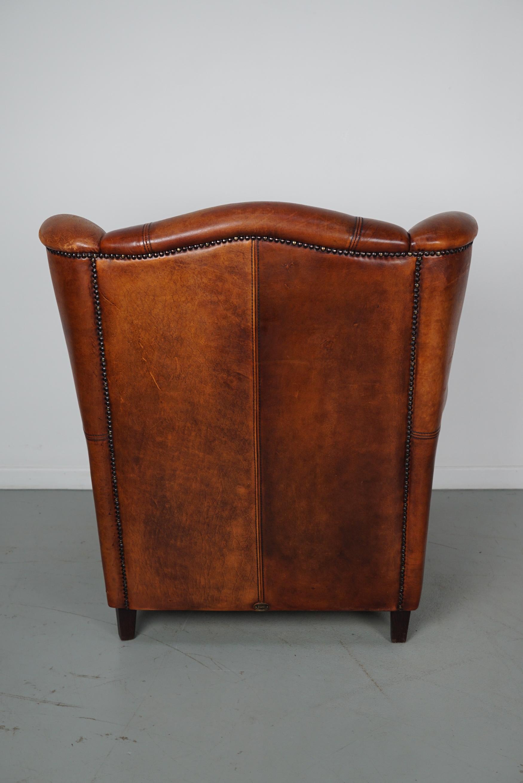 Cognacfarbener Clubsessel aus Leder im Angebot 7
