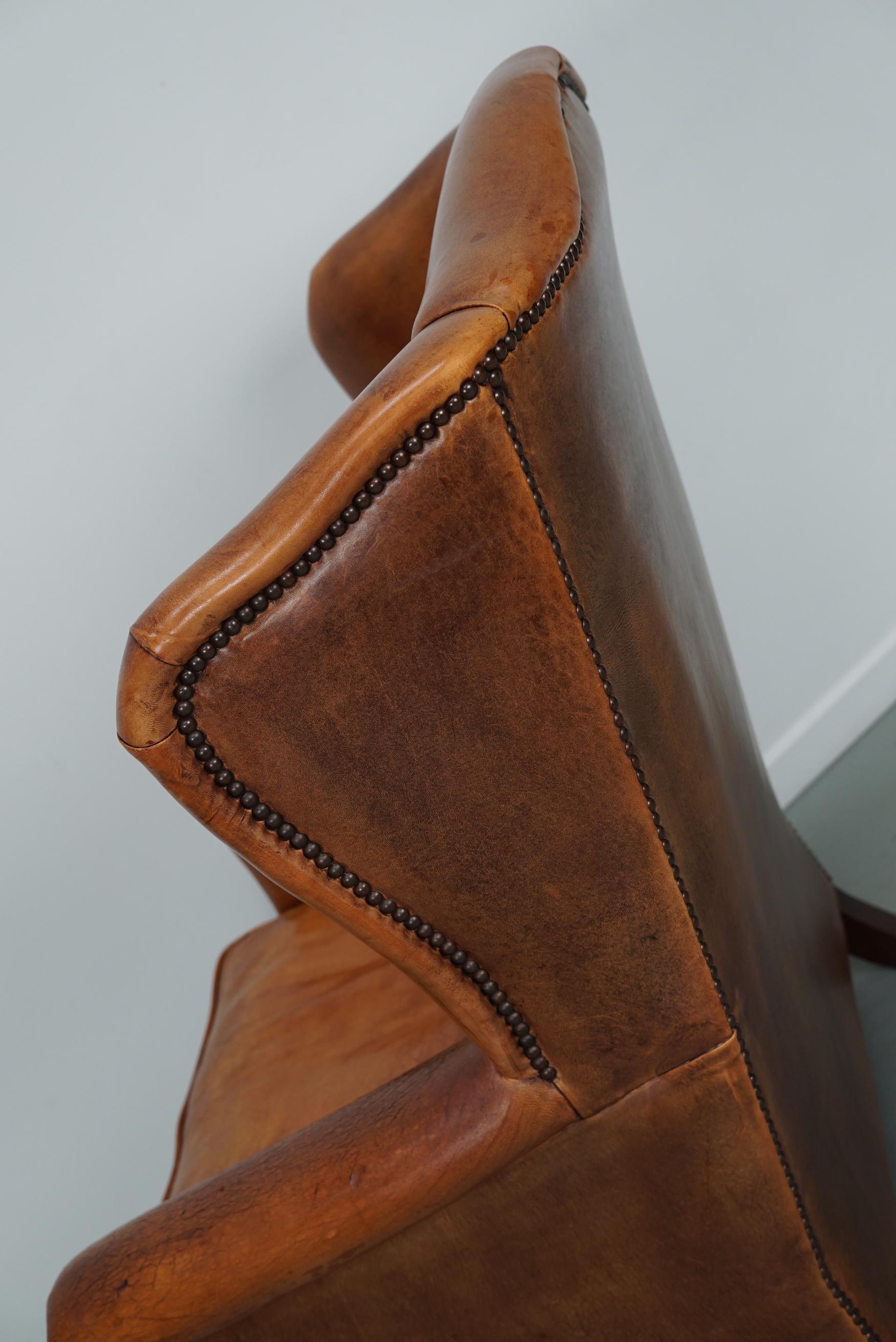 Cognacfarbener Clubsessel aus Leder im Angebot 7
