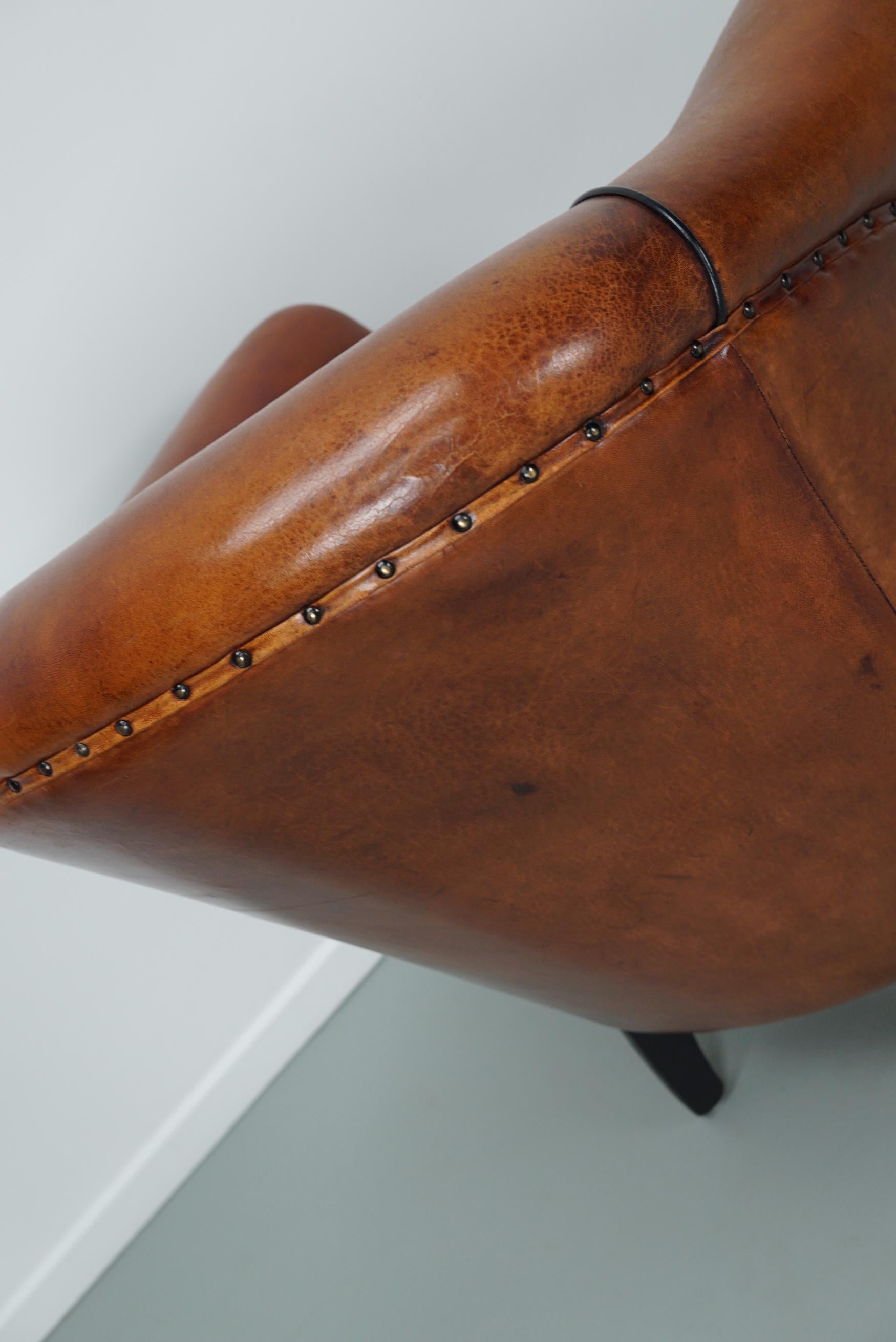 Cognacfarbener Clubsessel aus Leder im Angebot 7