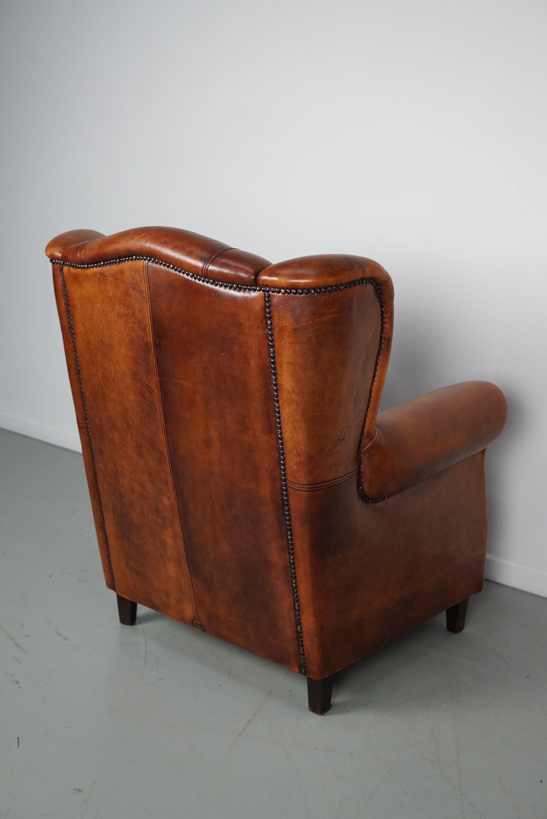 Cognacfarbener Clubsessel aus Leder im Angebot 8