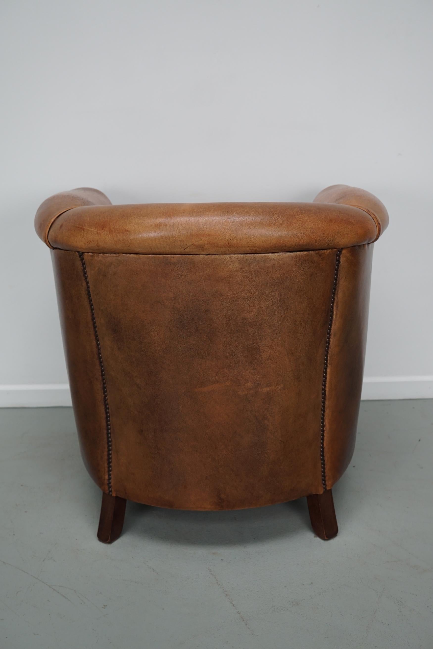 Cognacfarbener Clubsessel aus Leder im Angebot 8