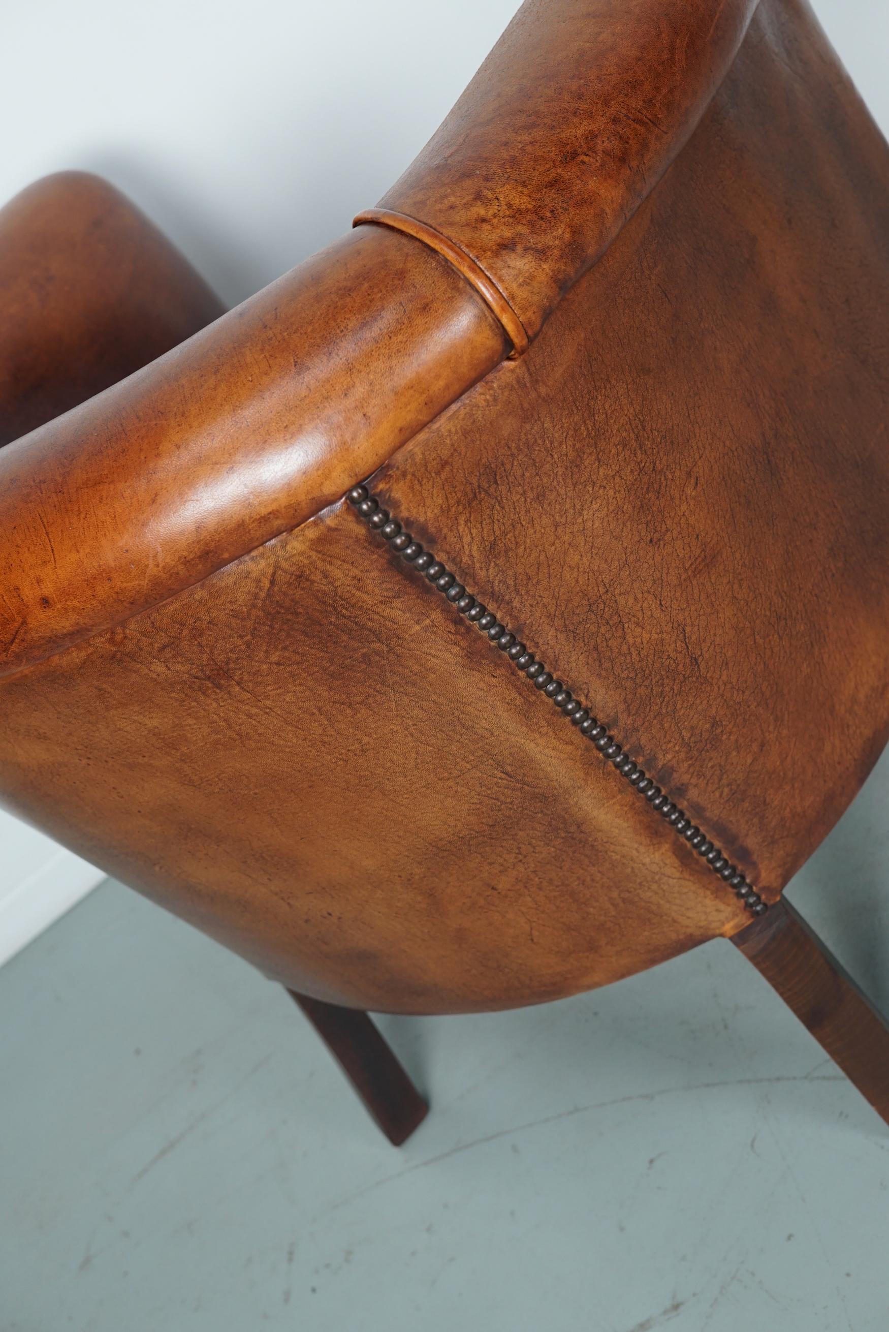 Cognacfarbener Clubsessel aus Leder im Angebot 9