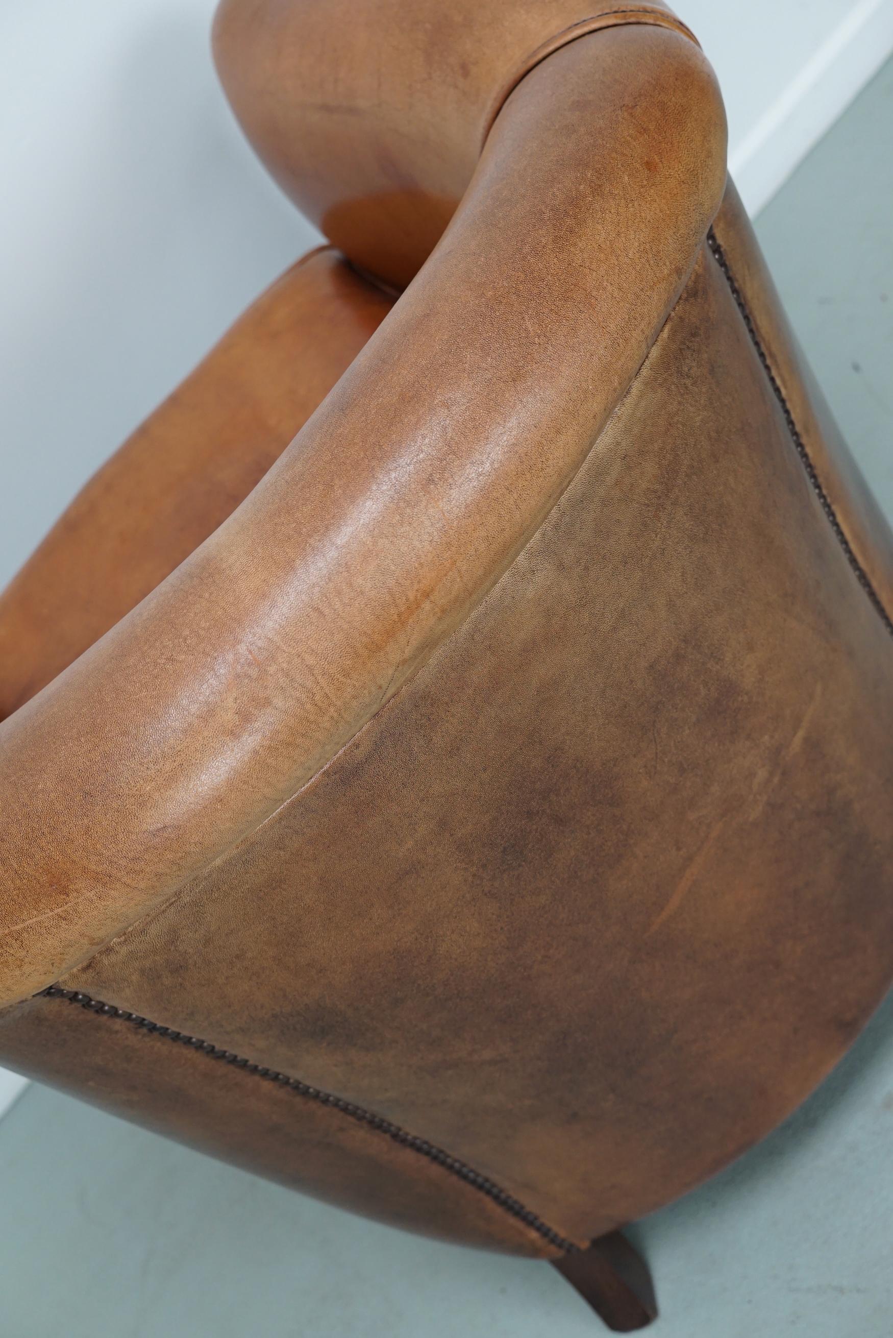 Cognacfarbener Clubsessel aus Leder im Angebot 9