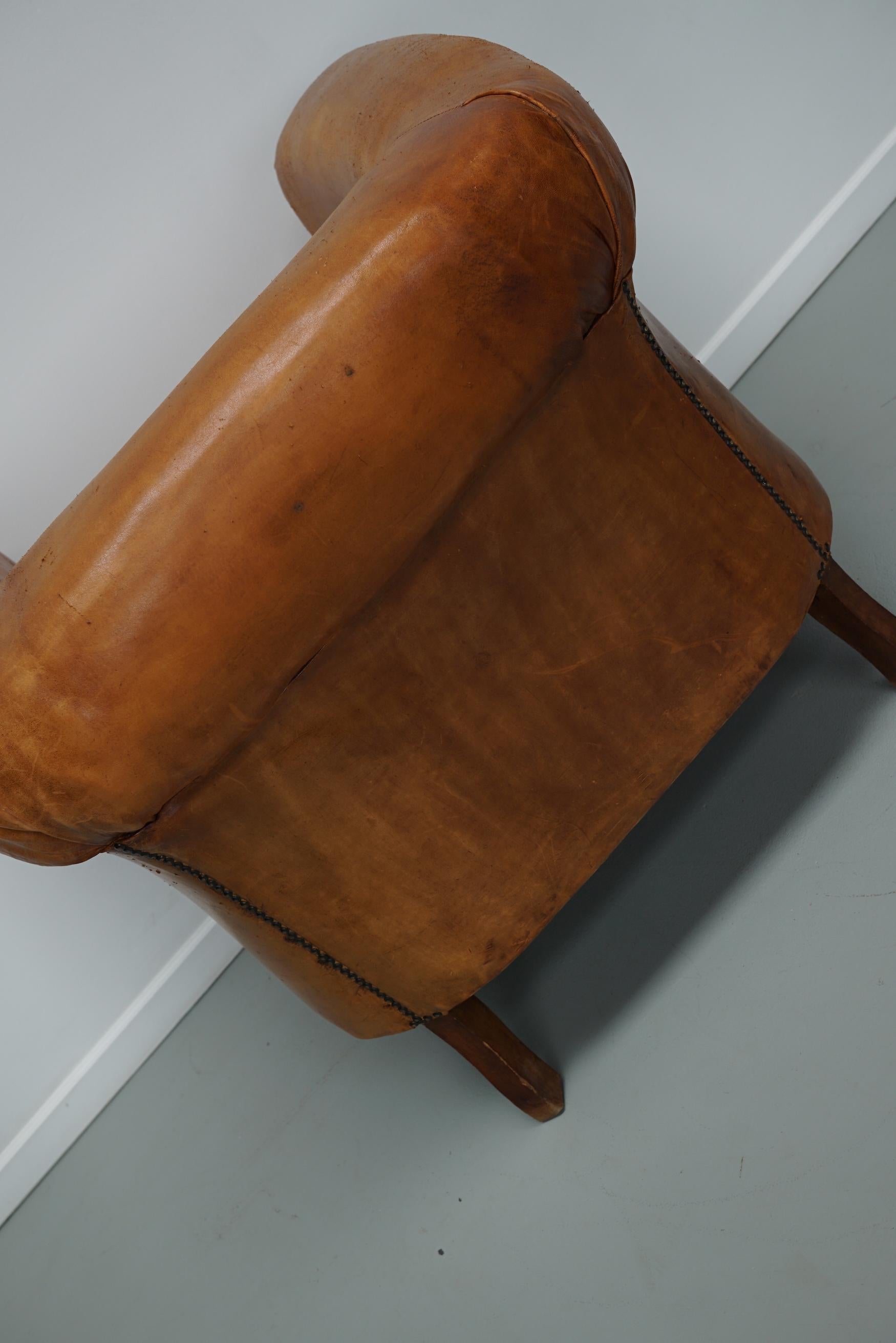 Cognacfarbener Clubsessel aus Leder im Angebot 10
