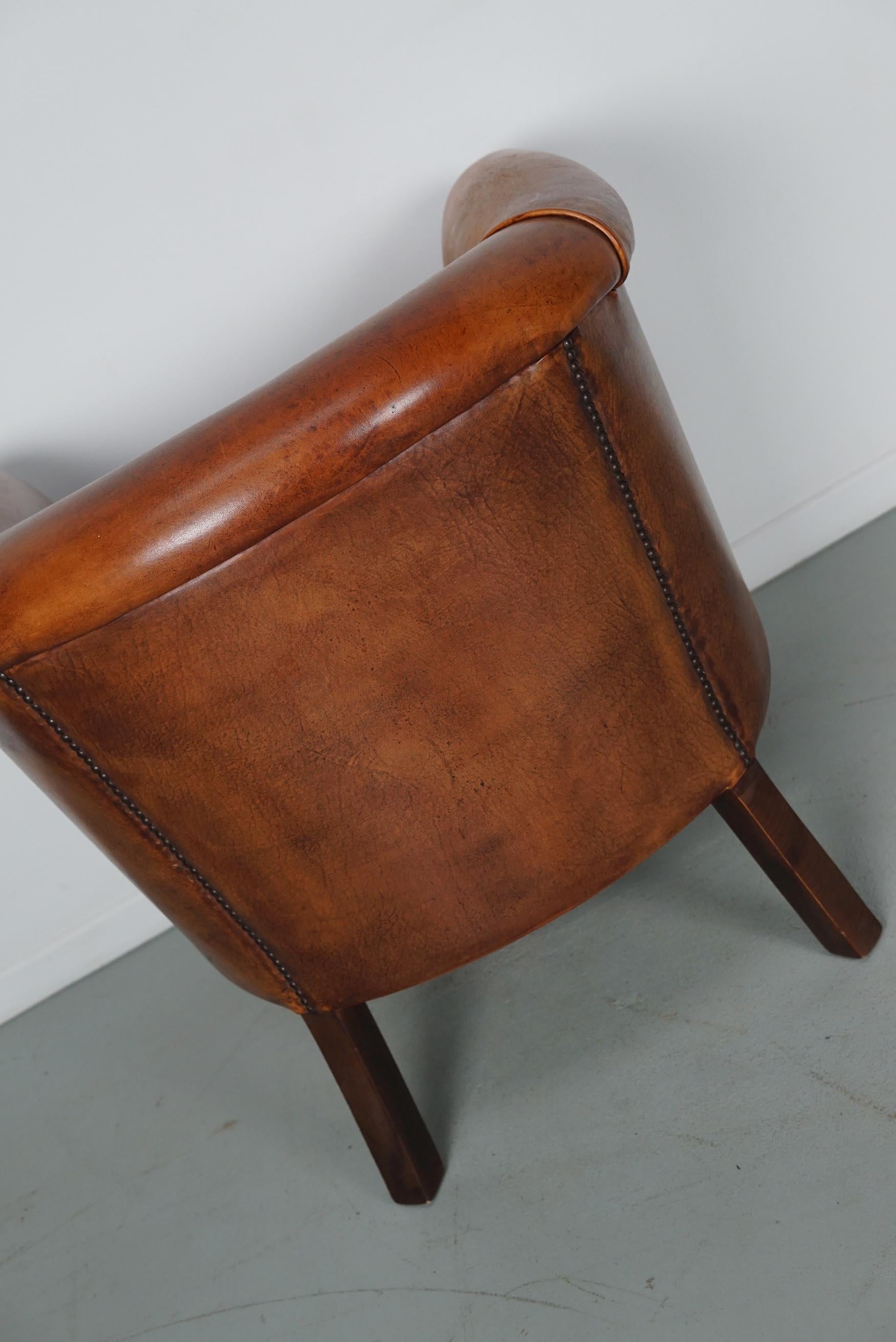 Cognacfarbener Clubsessel aus Leder im Angebot 10
