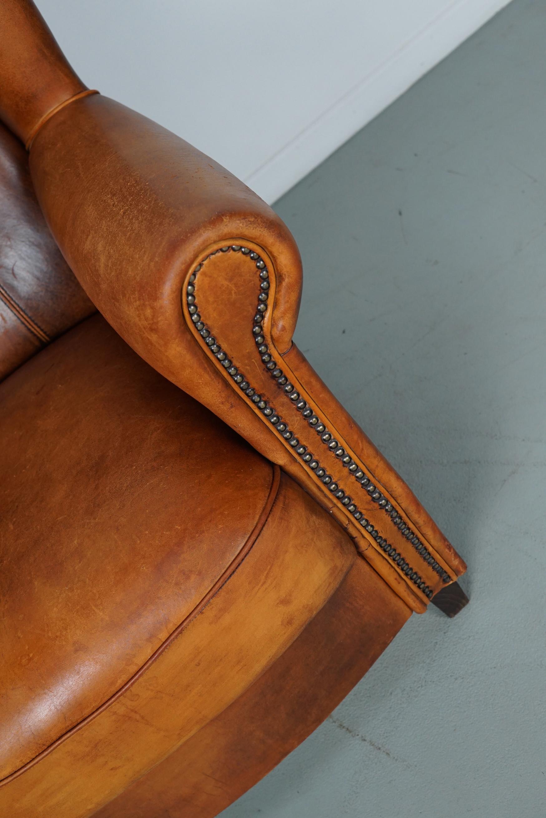 Cognacfarbener Clubsessel aus Leder im Angebot 10