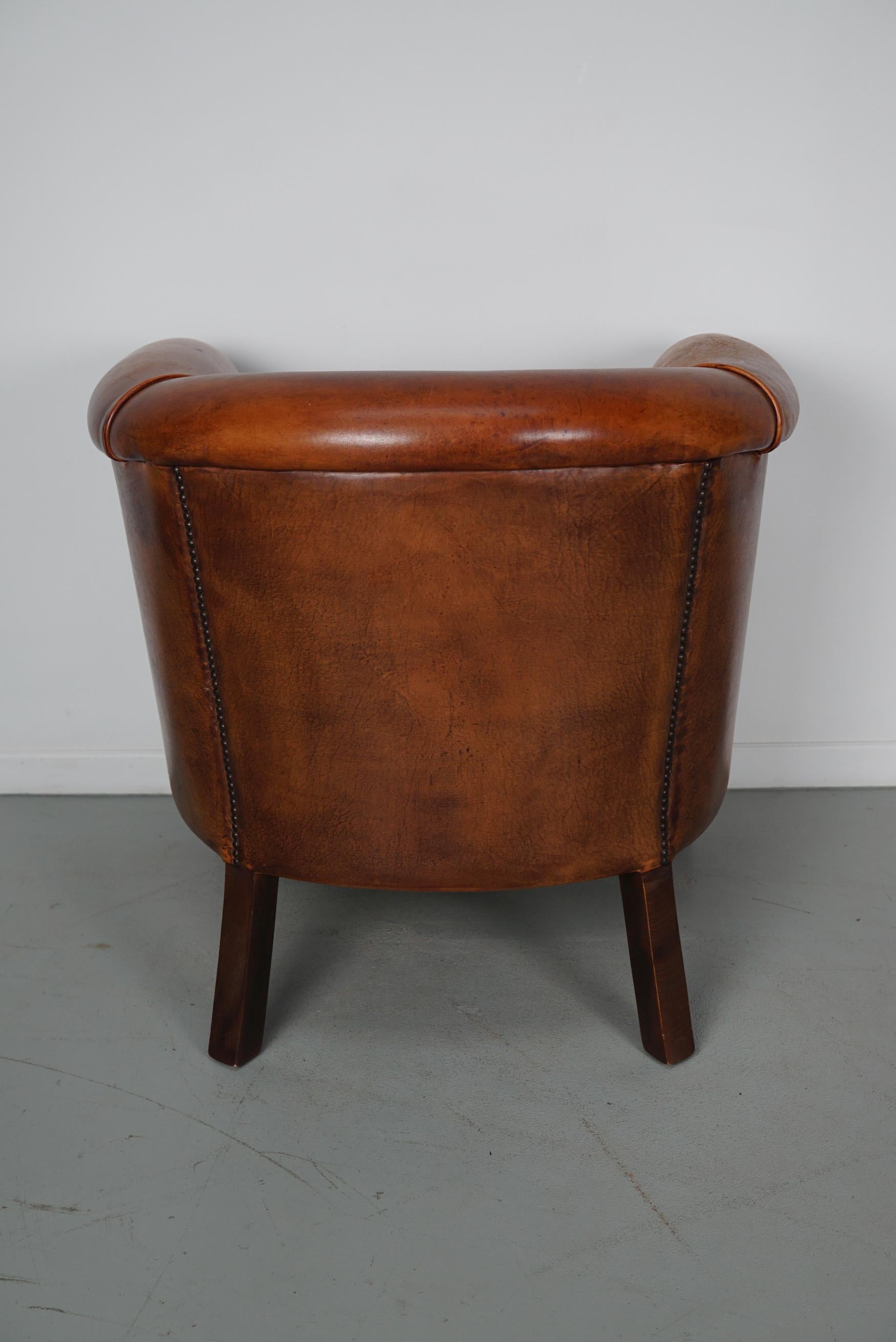 Cognacfarbener Clubsessel aus Leder im Angebot 11