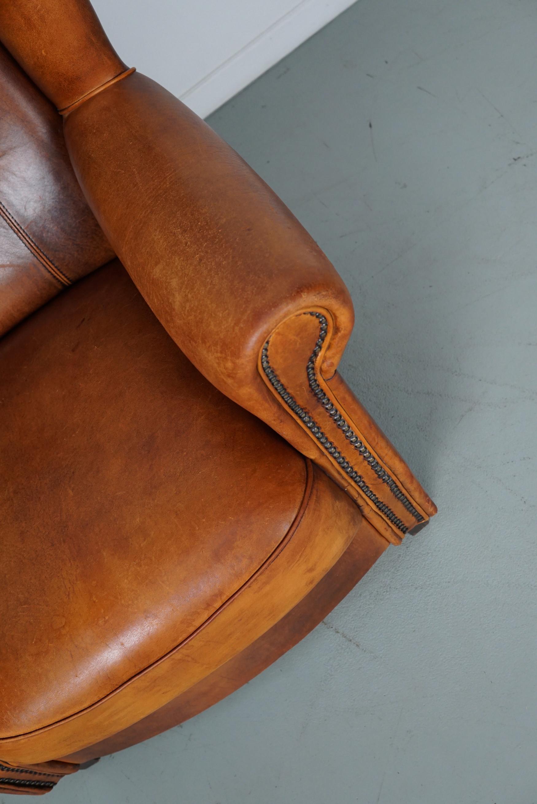 Cognacfarbener Clubsessel aus Leder im Angebot 11
