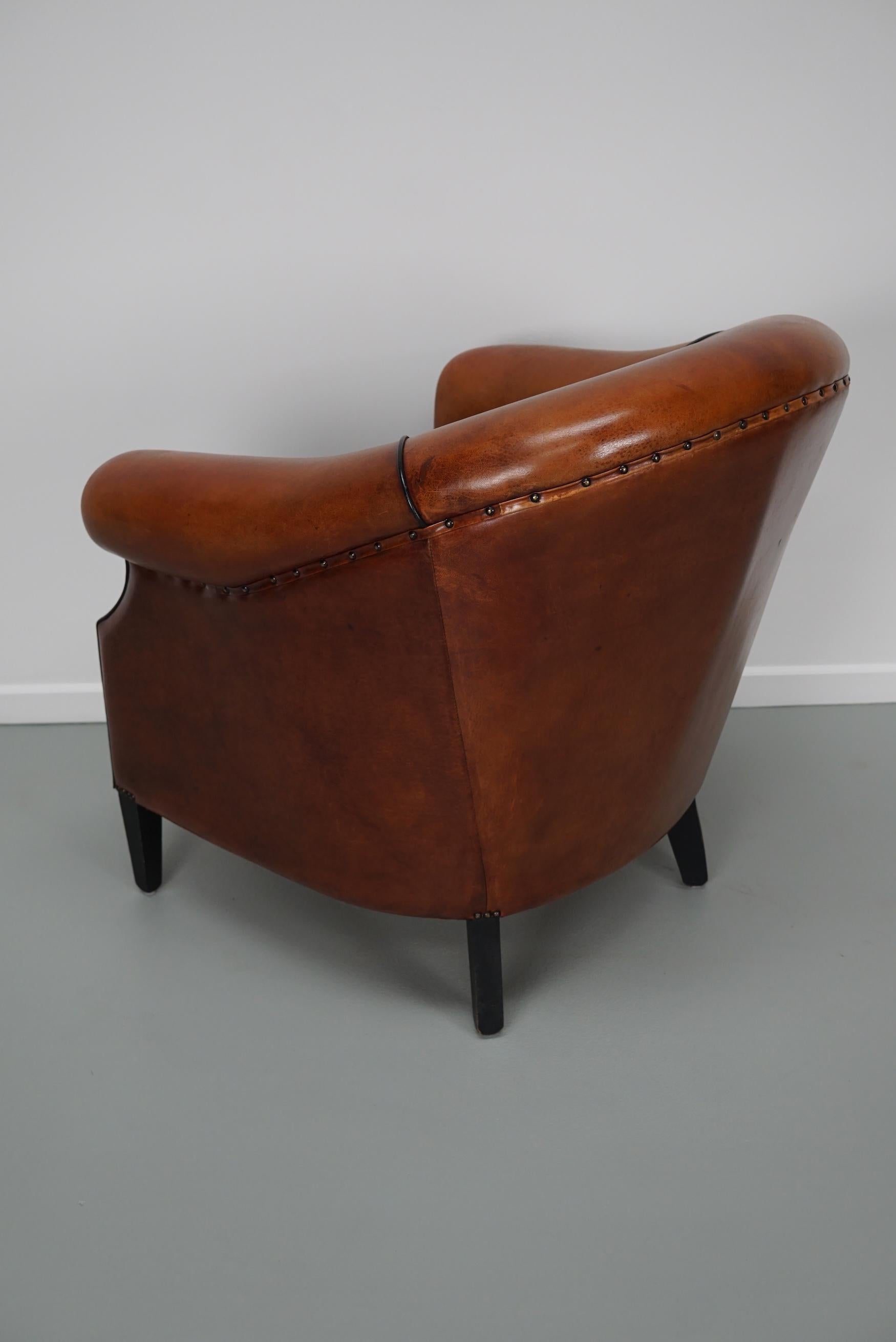 Cognacfarbener Clubsessel aus Leder im Angebot 11