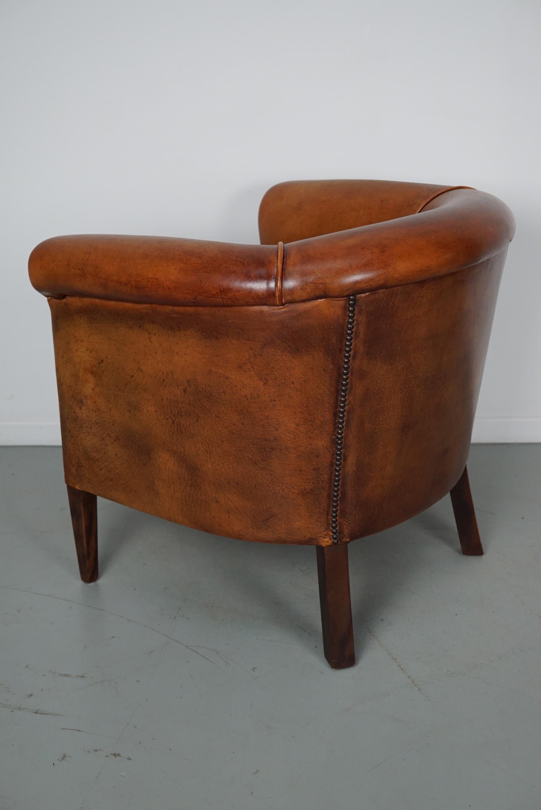 Cognacfarbener Clubsessel aus Leder im Angebot 12