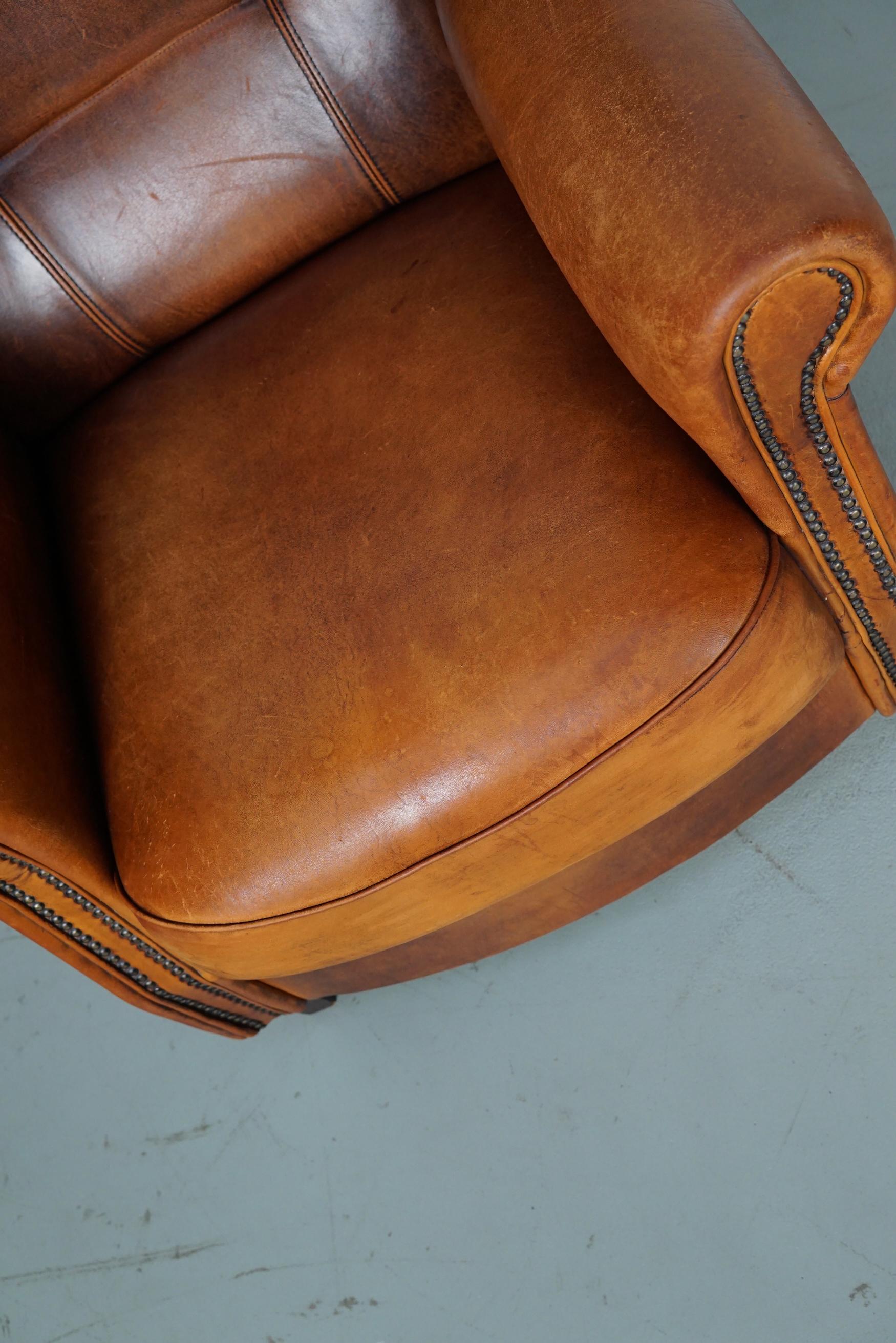 Cognacfarbener Clubsessel aus Leder im Angebot 12