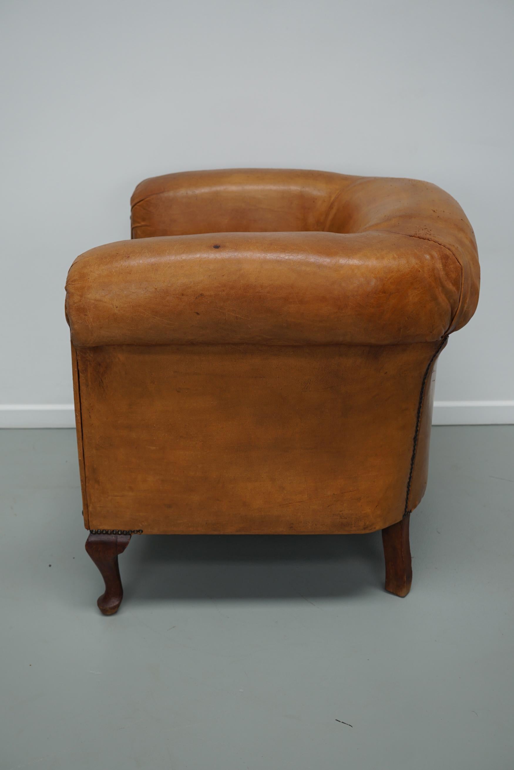 Cognacfarbener Clubsessel aus Leder im Angebot 13