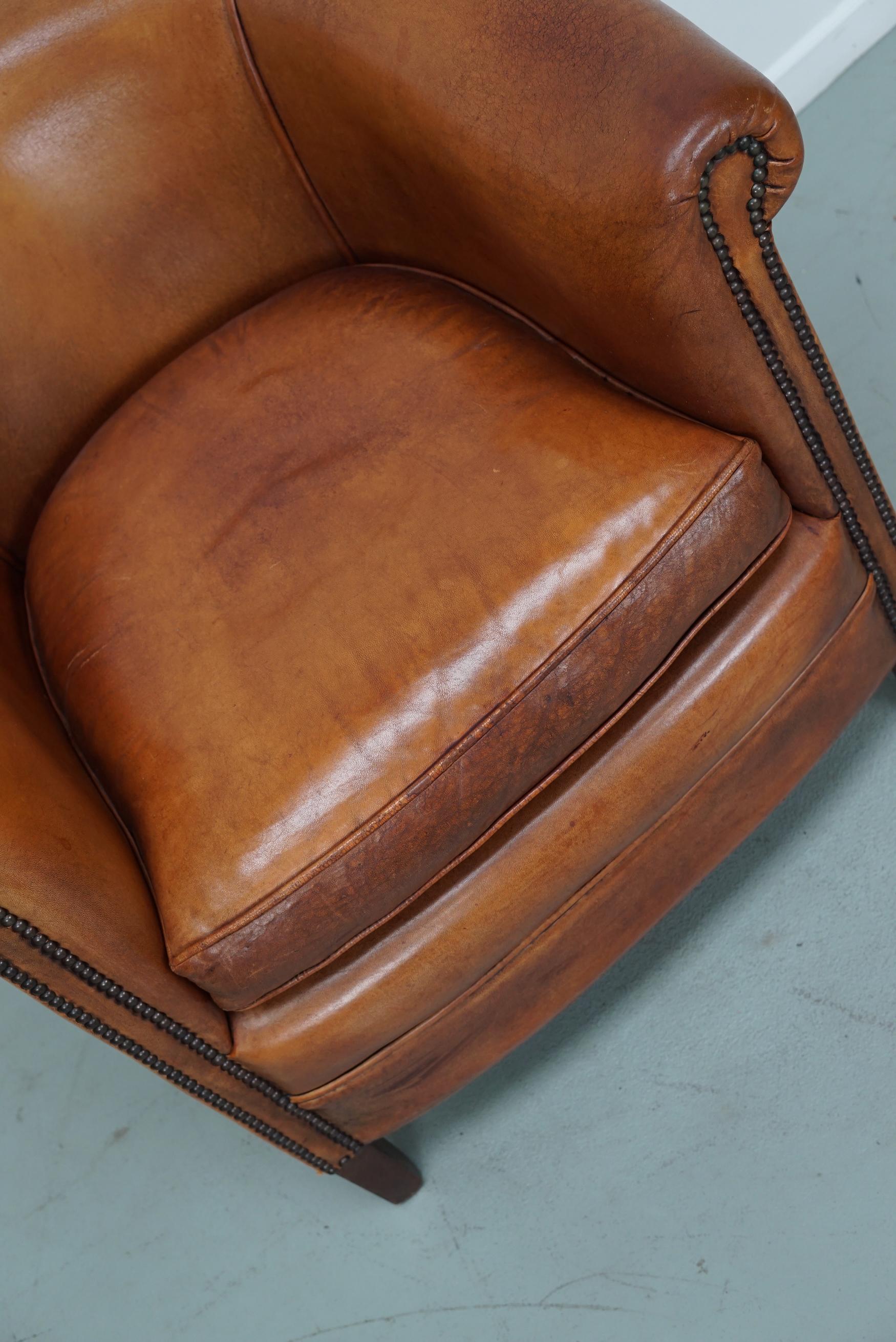 Cognacfarbener Clubsessel aus Leder (Ende des 20. Jahrhunderts) im Angebot