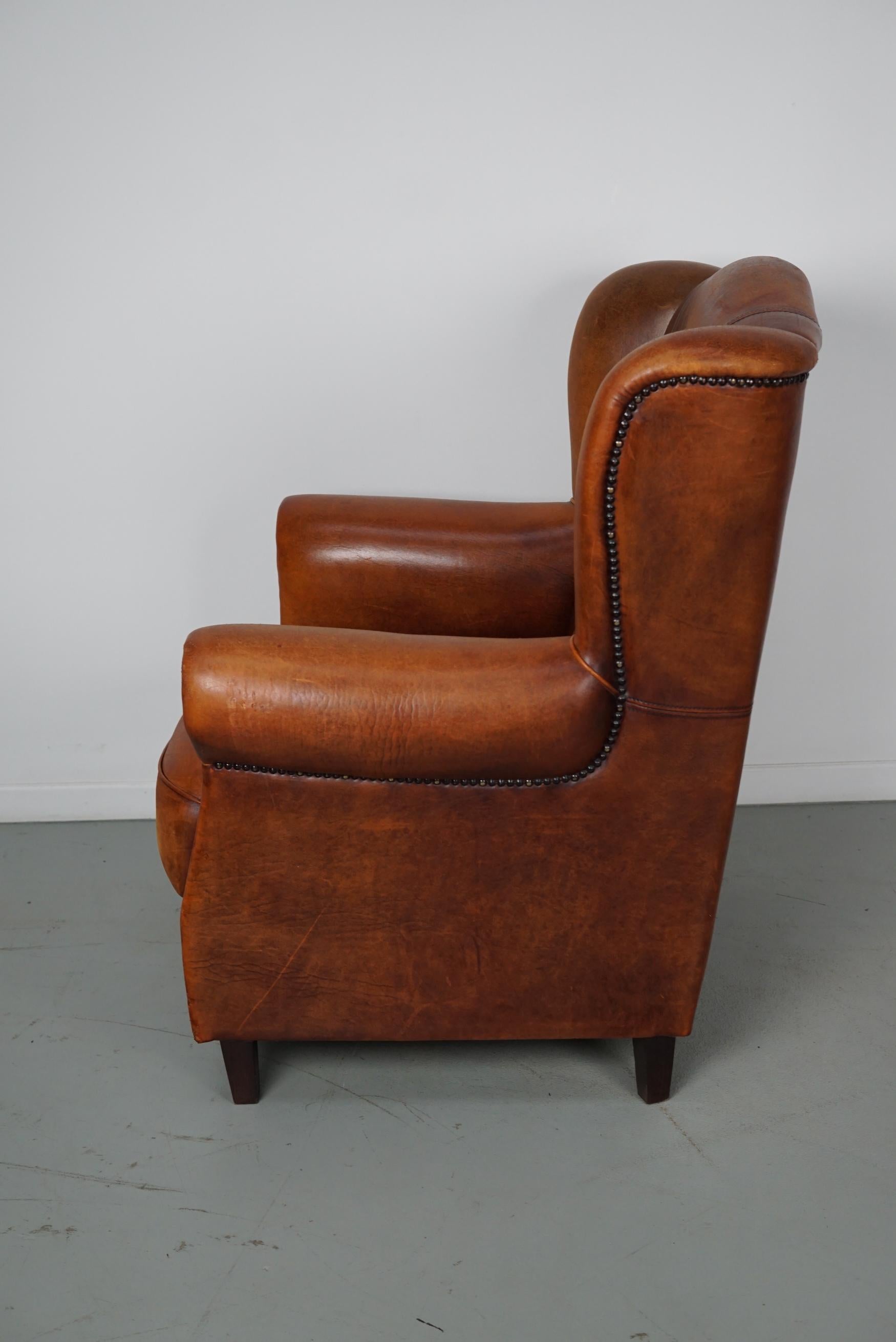 Cognacfarbener Clubsessel aus Leder im Angebot 1