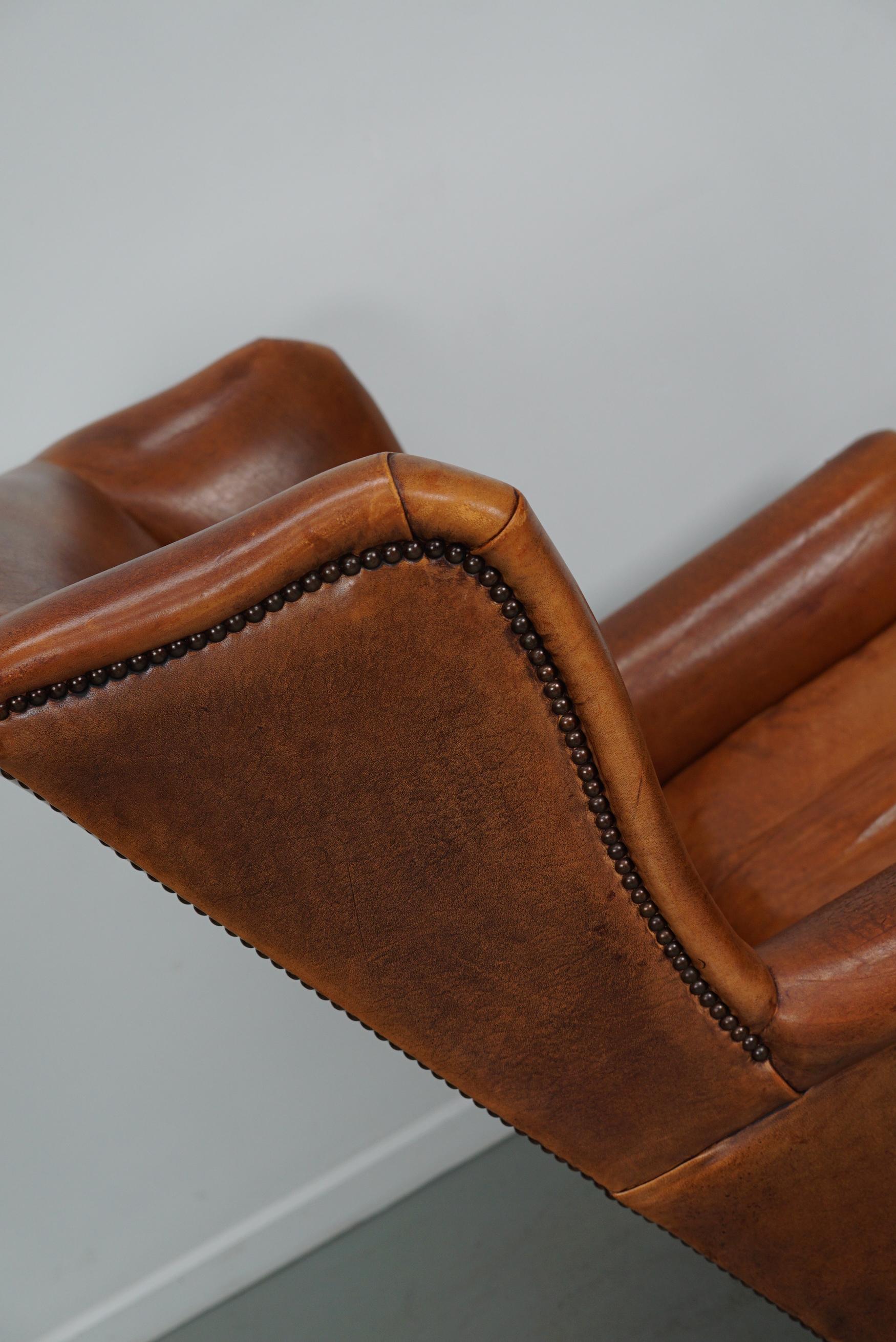 Cognacfarbener Clubsessel aus Leder im Angebot 2