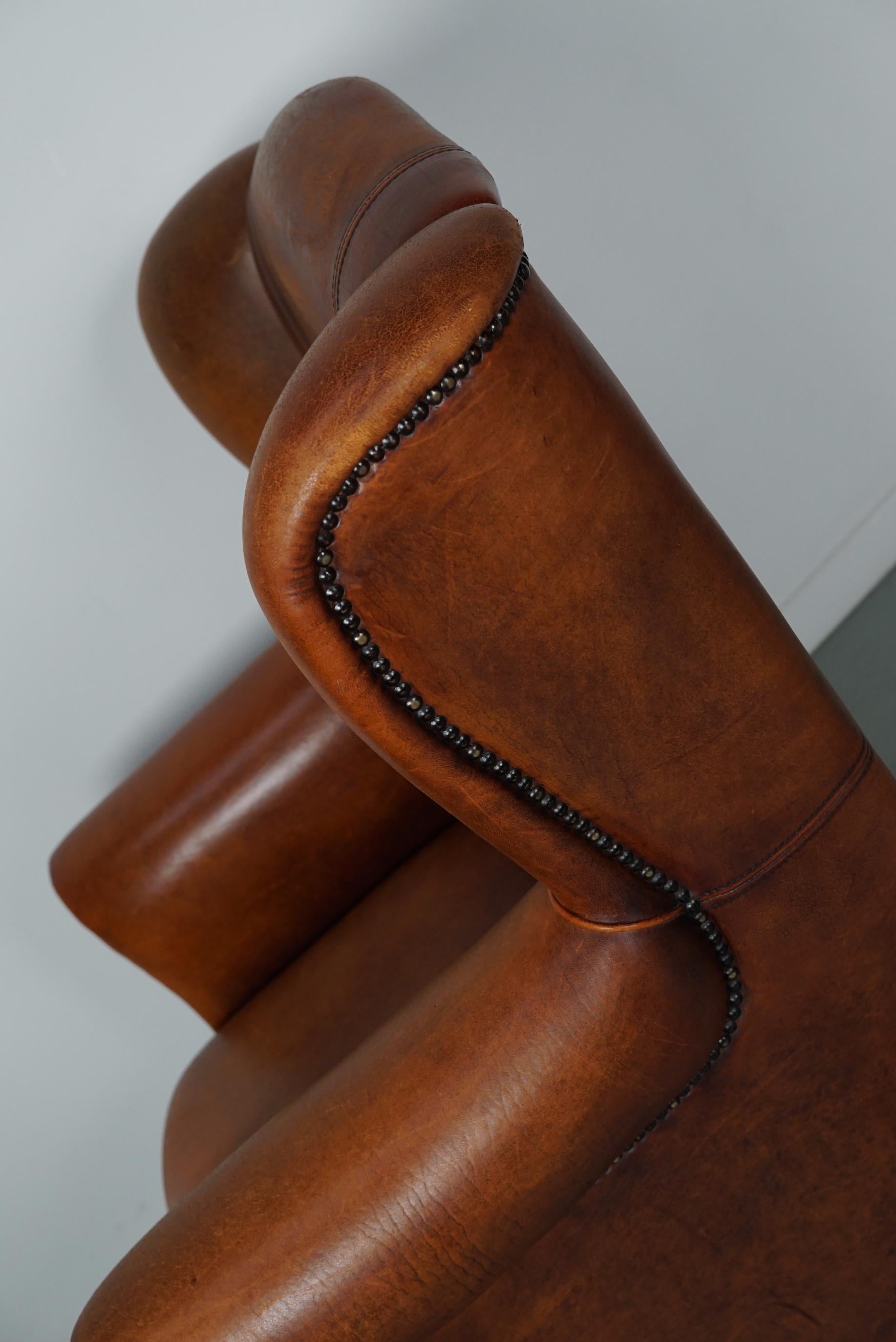 Cognacfarbener Clubsessel aus Leder im Angebot 3
