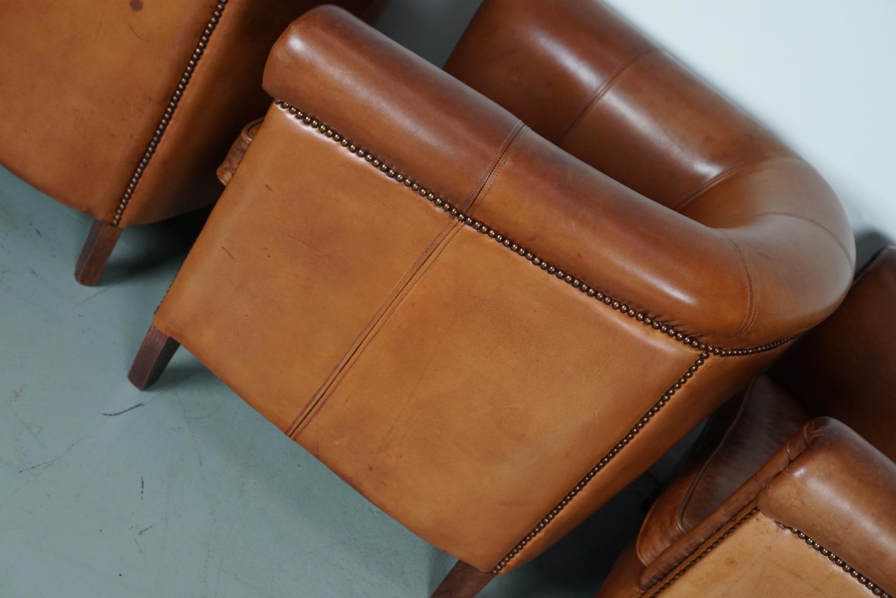 Late 20th Century  Vintage Dutch Cognac Leather Club Chairs, Set of Three with Two Footstools For Sale
