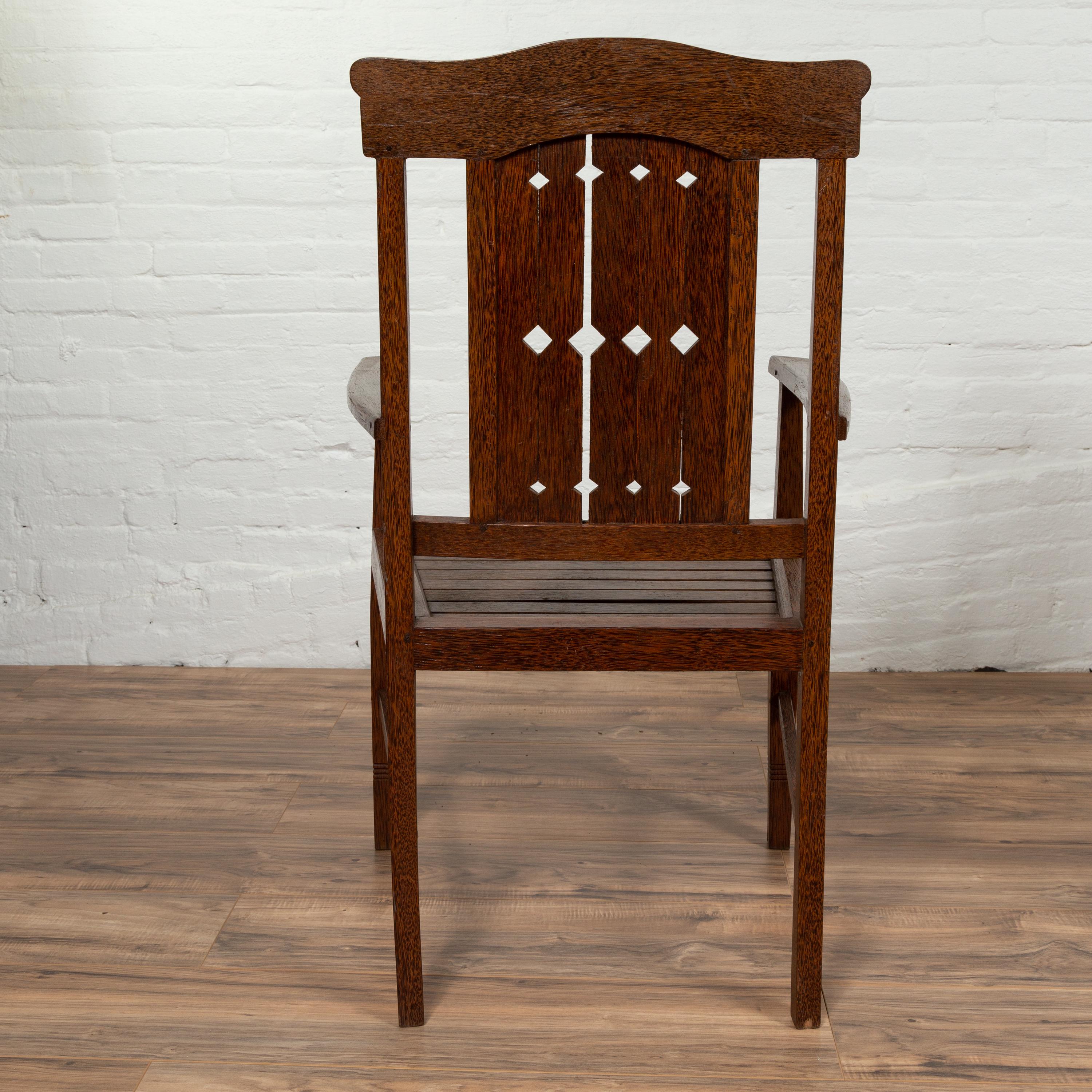 20th Century Vintage Dutch Colonial Armchair with Pierced Wooden Slats and Bonnet-Style Rail For Sale