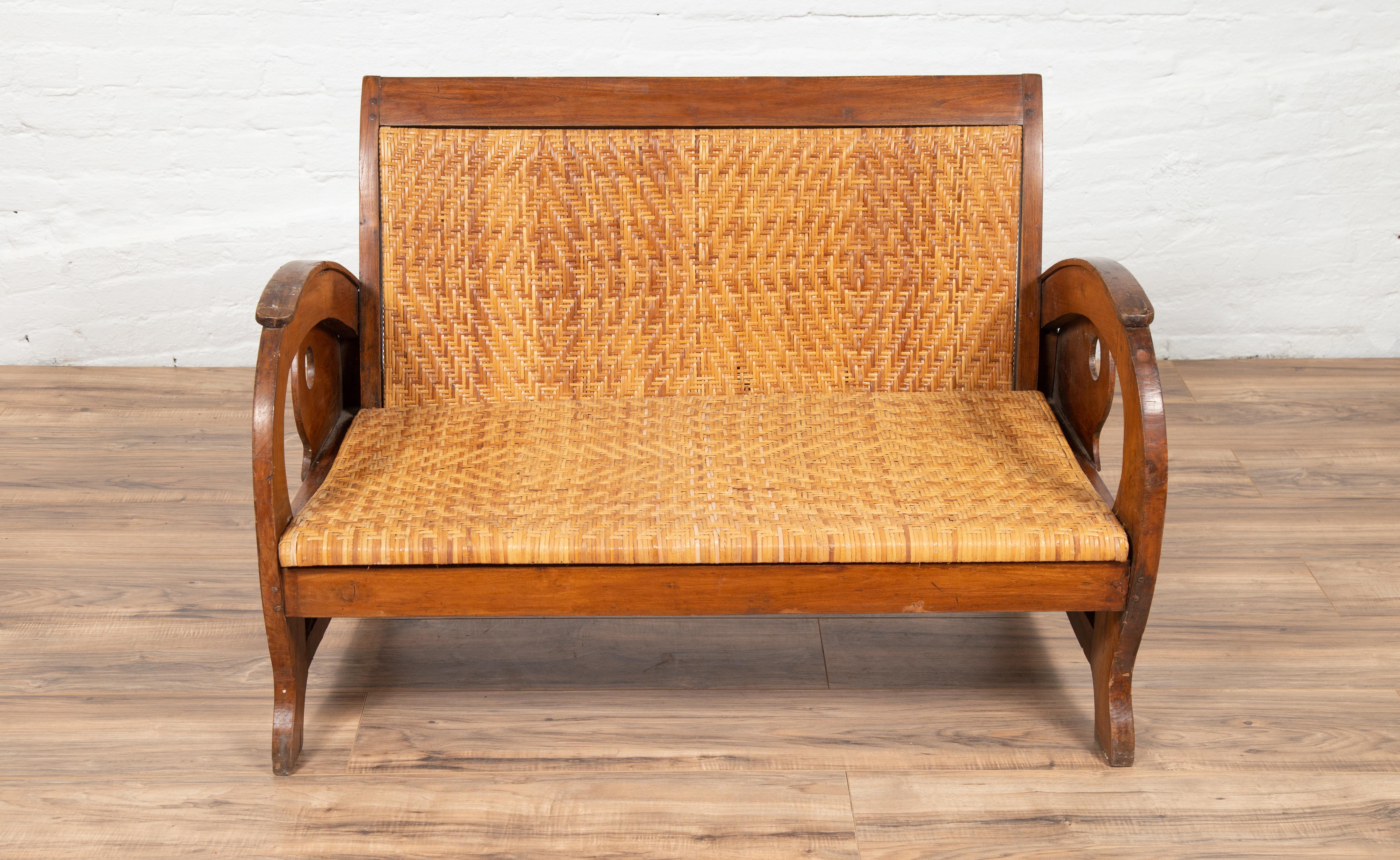 Indonesian Vintage Dutch Colonial Midcentury Teak Wood and Rattan Settee with Looping Arms