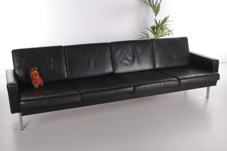 This 4-seater sofa is a beautiful design by Martin Visser.

Produced by 't Spectrum in 1968. This sofa has chromed Minimalist legs and is still equipped with original black leather cushions.

Absolutely beautiful due to the aged patina.

It is