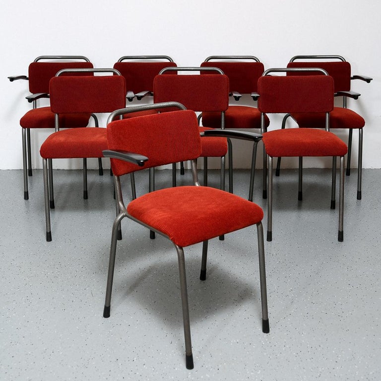 Dutch Industrial Gispen armchairs. Known as the ‘Th. Delft Chair’, this chair was designed in 1952 for the Technical University Delft by W.H.Gispen.
Newly upholstered in red-brown corduroy fabric. Gray hammer finished metal frame and bakelite arm