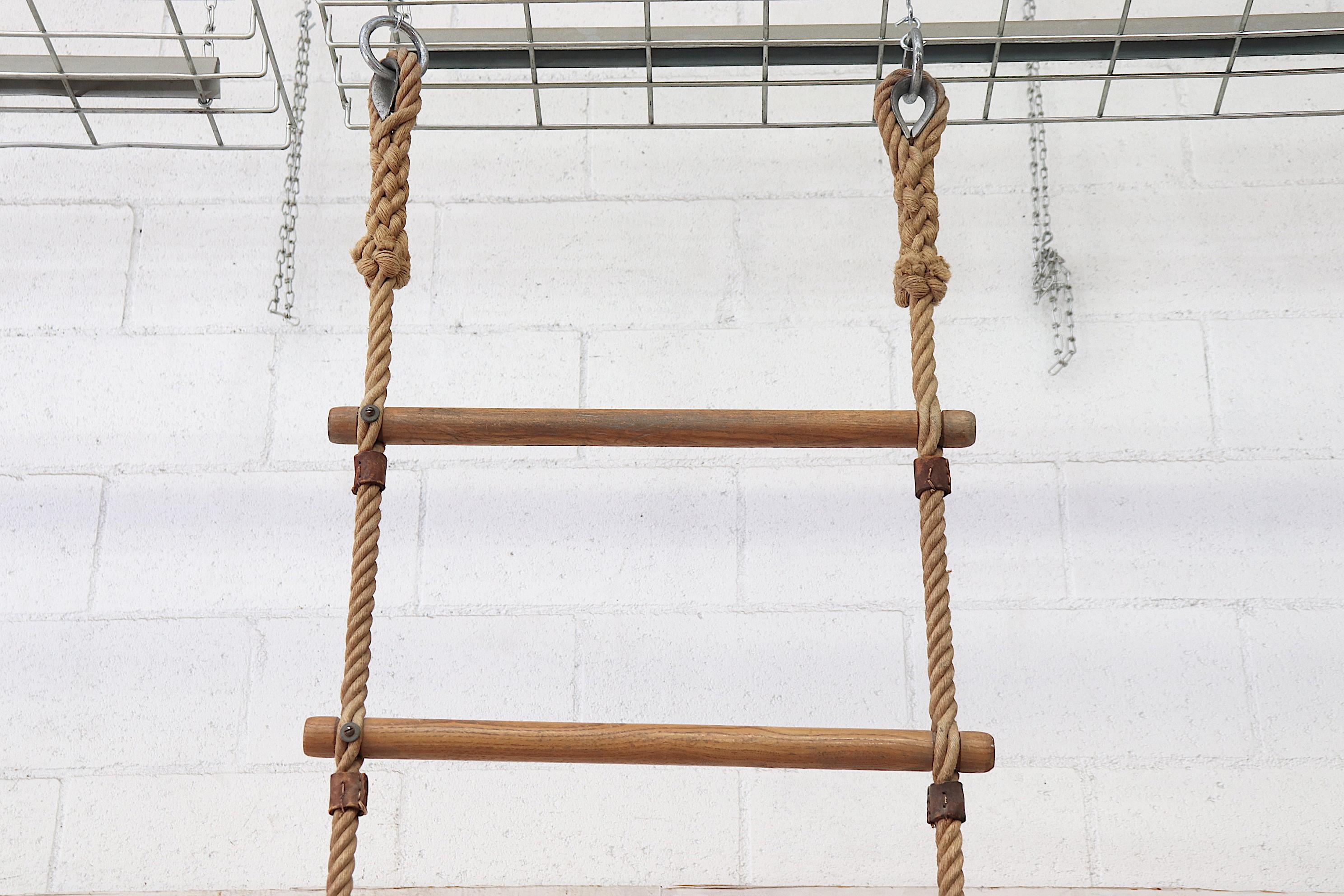 Extra tall vintage Dutch school gym rope ladder with leather accents and wood rungs. Very original condition, has some fraying, particularly at the end.
