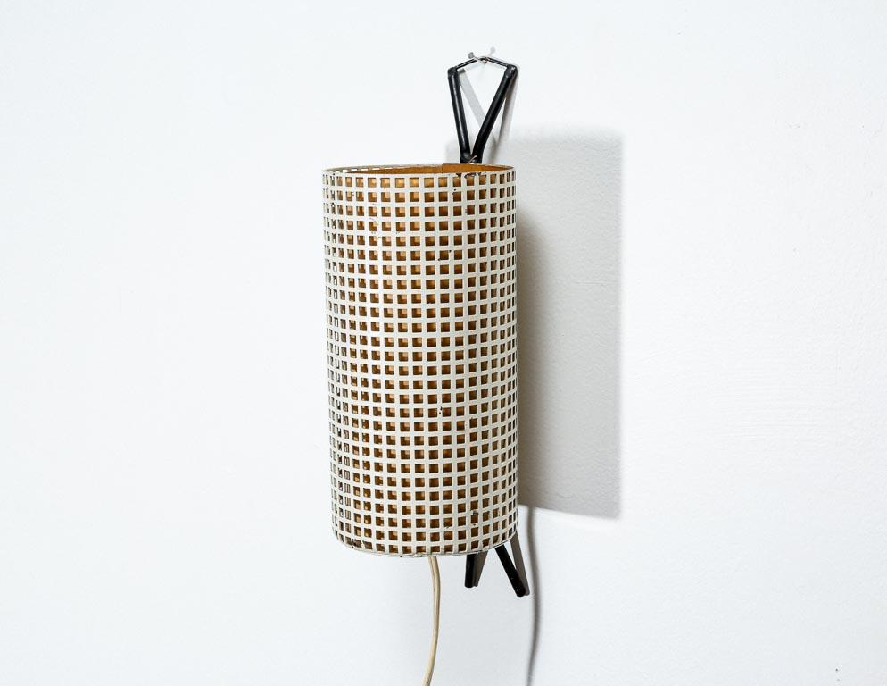 Vintage sconce by Pilastro, Holland. White perforated steel with parchment inner shade. Black hanger and feet.
