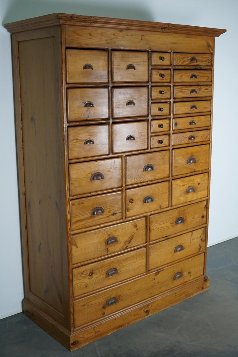 Industrial Vintage Dutch Pine Apothecary Cabinet For Sale