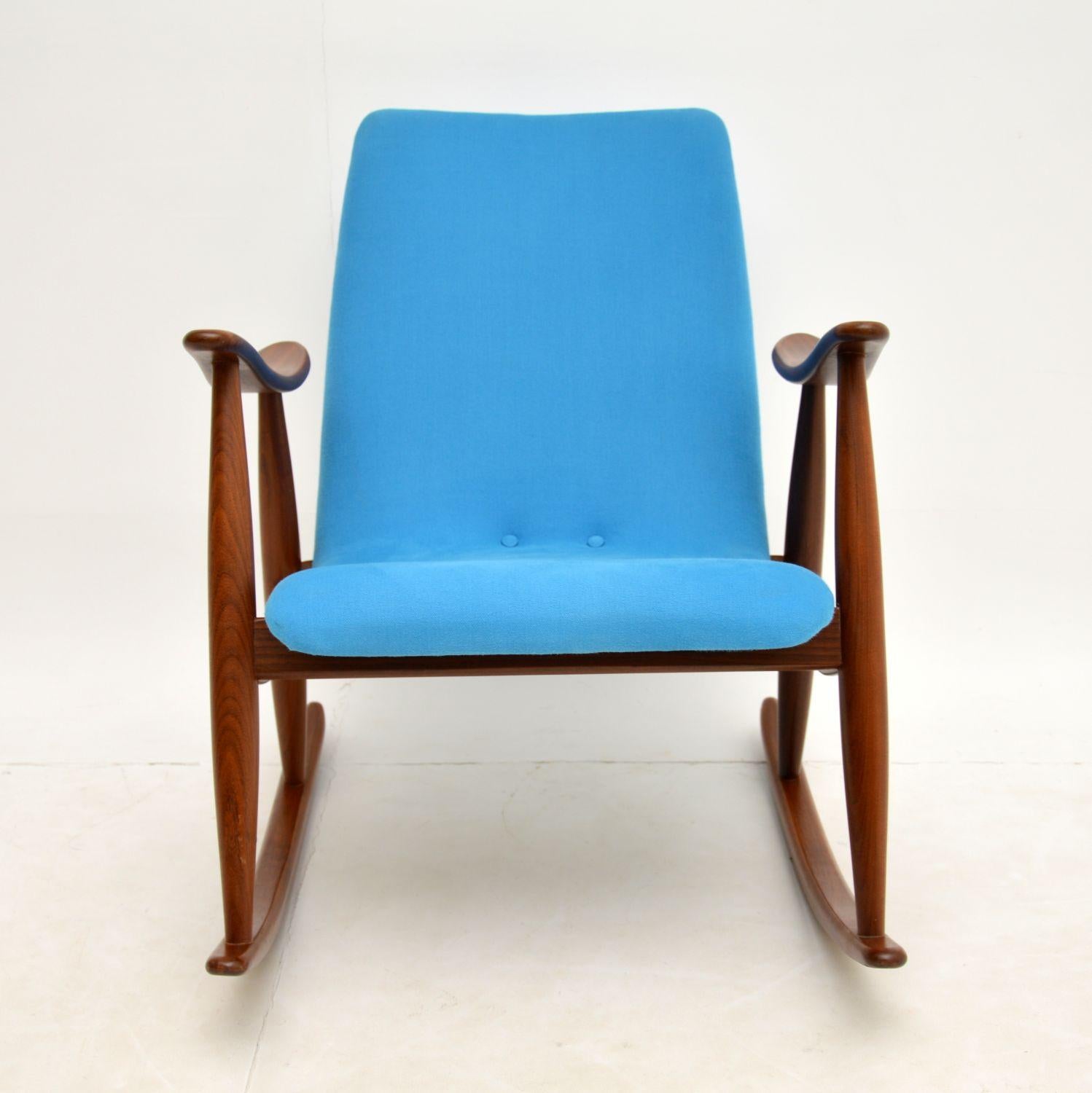 A beautiful, extremely comfortable and rare Dutch rocking chair. This was designed by Louis Van Teefelen, it dates from the 1960’s.

We have had it fully restored, the condition is superb throughout. The solid afromosia wood frame has been